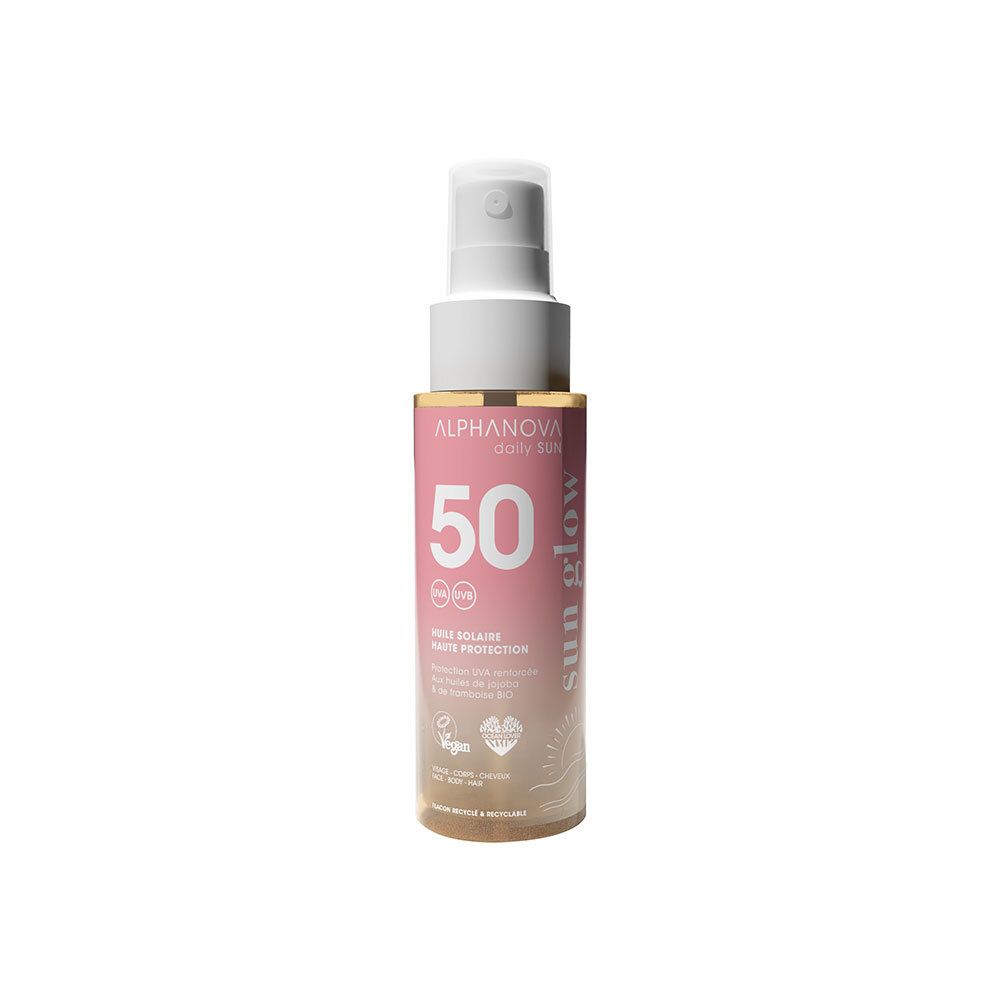 Spray d'huile solaire. Flacon rose-doré avec vaporisateur blanc. Inscription : 50 SPF, Alphanova Sun Glow.