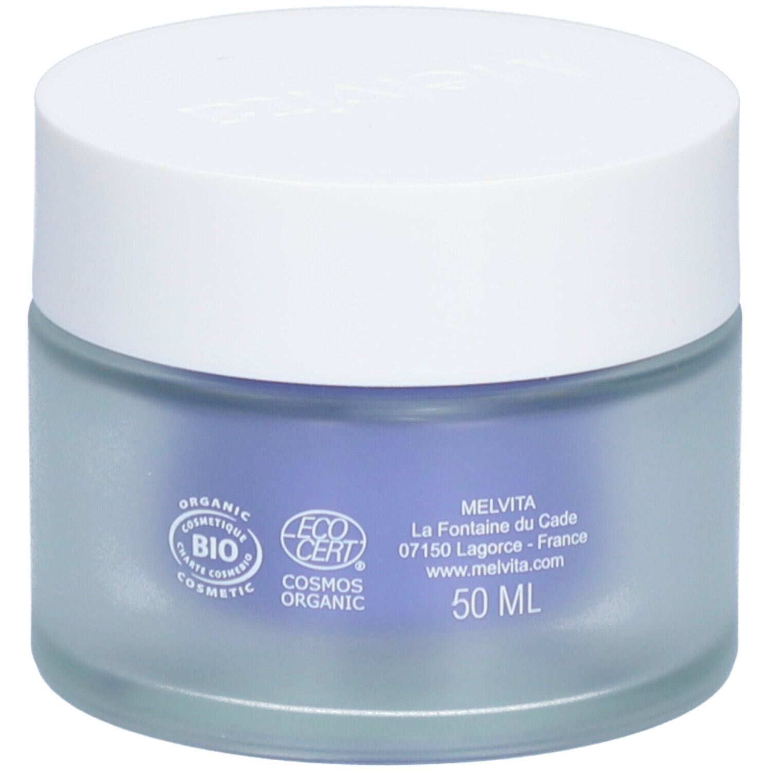 Ronde pot met witte deksel. Logo's en tekst op het blauwe glas. Inhoud van 50 ml. Gemaakt in Frankrijk.