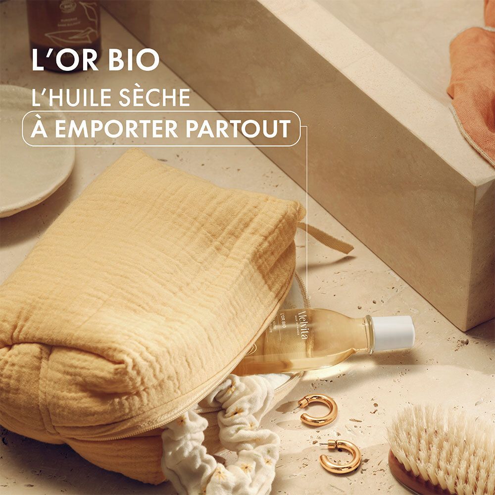 Melvita L'Or Bio oliefles in een tas. Andere producten en accessoires.