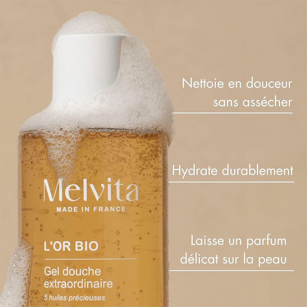 Melvita L'Or Bio Gel Douche Extraordinaire. Fles met schuim. Teksten: Reinigt, hydrateert, geurt.