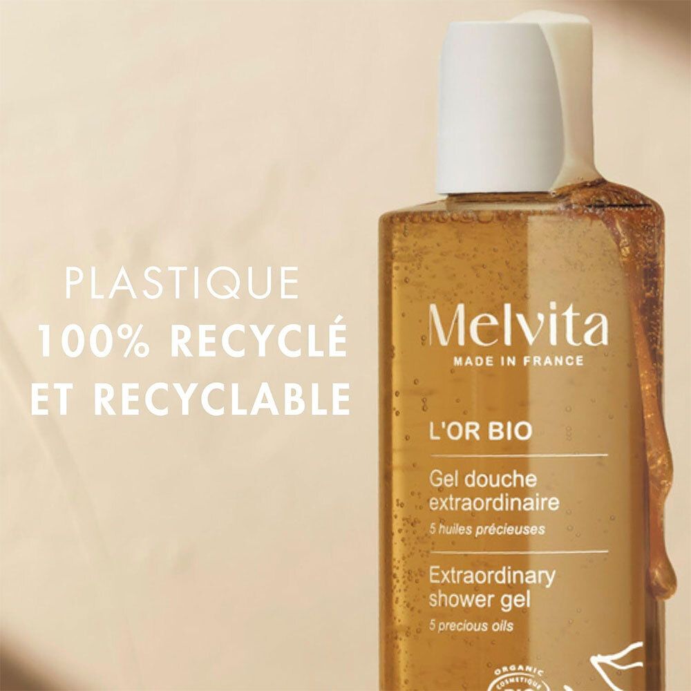 Melvita L'Or Bio Gel Douche Extraordinaire. Fles met tekst: 100% gerecycled en recyclebaar.