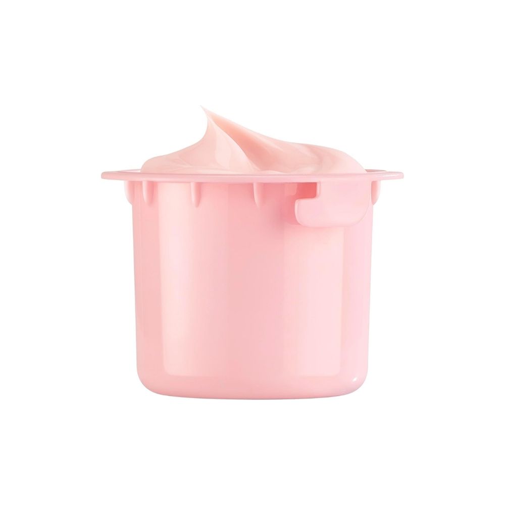 Een kleine roze container met een romige, roze substantie die eruit steekt.