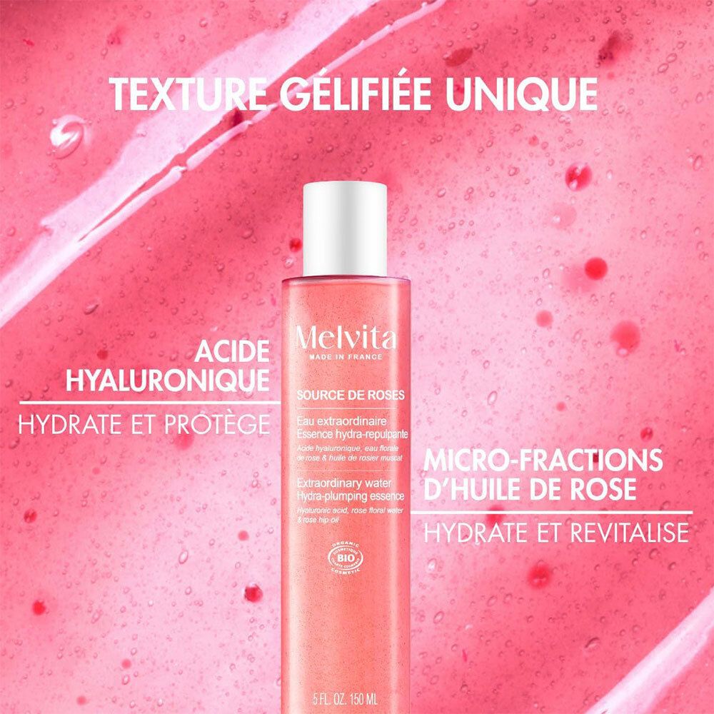 Rozen essence fles met witte dop. Tekst: Acide hyaluronique, hydrate et protège.