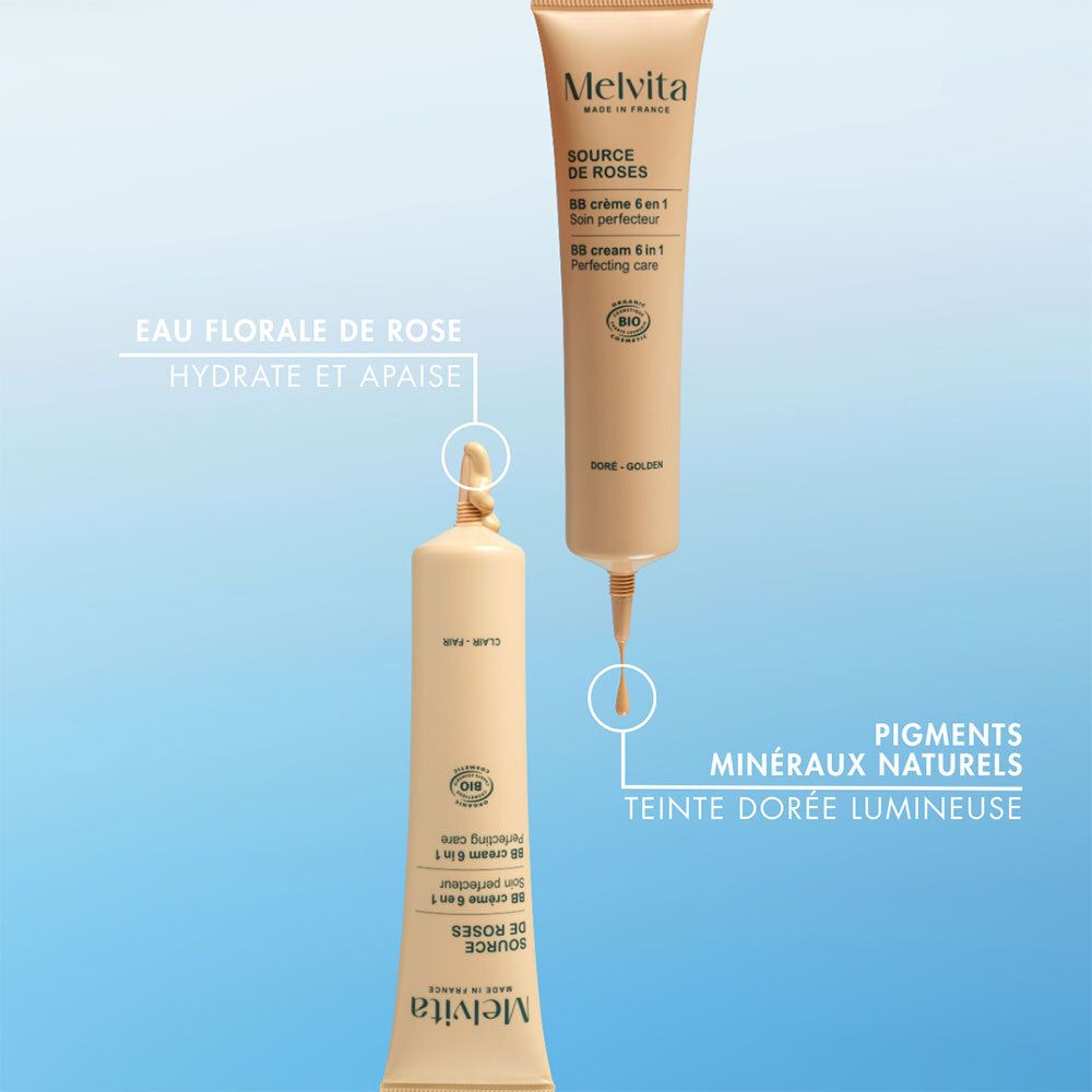 Twee BB Cream tubes. Druppels. Natuurlijke minerale pigmenten. Gouden, heldere kleur. Blauwe achtergrond.