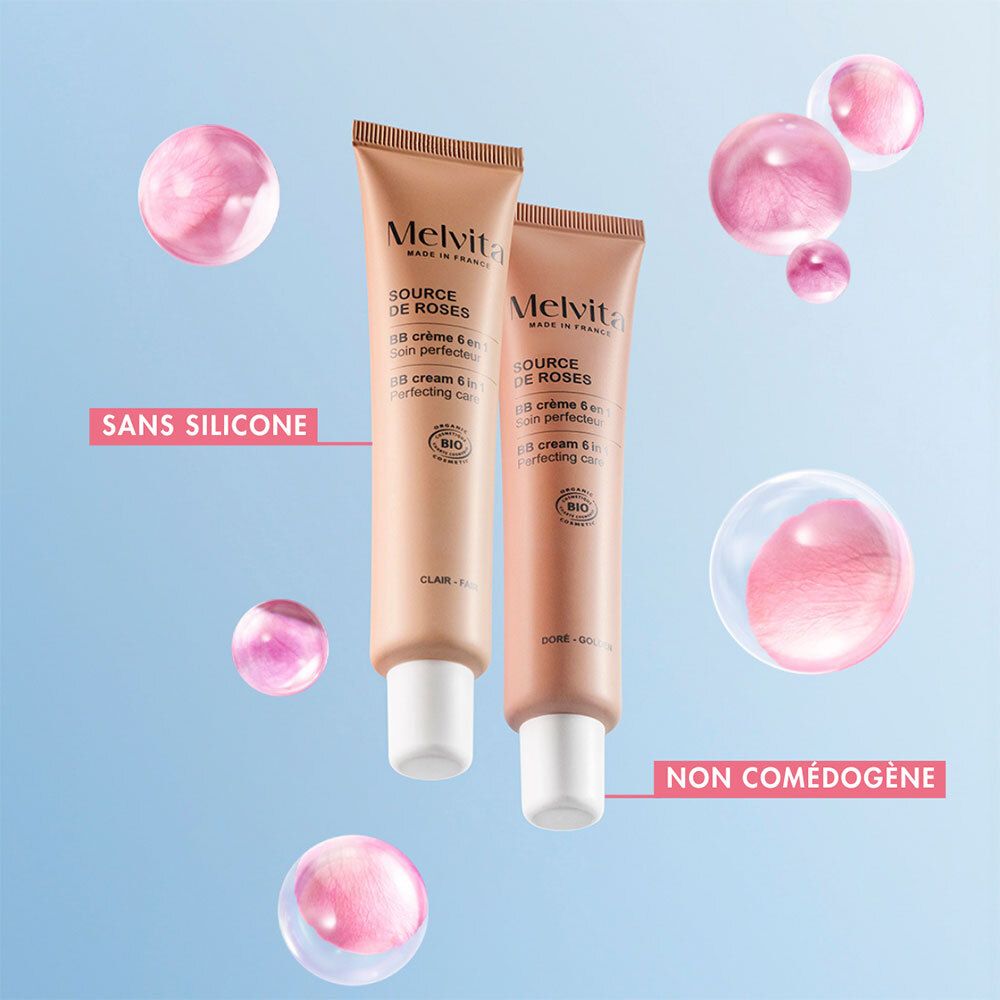 Twee BB Cream tubes. Zonder siliconen. Niet comedogeen. Roze bellen. Blauwe achtergrond.