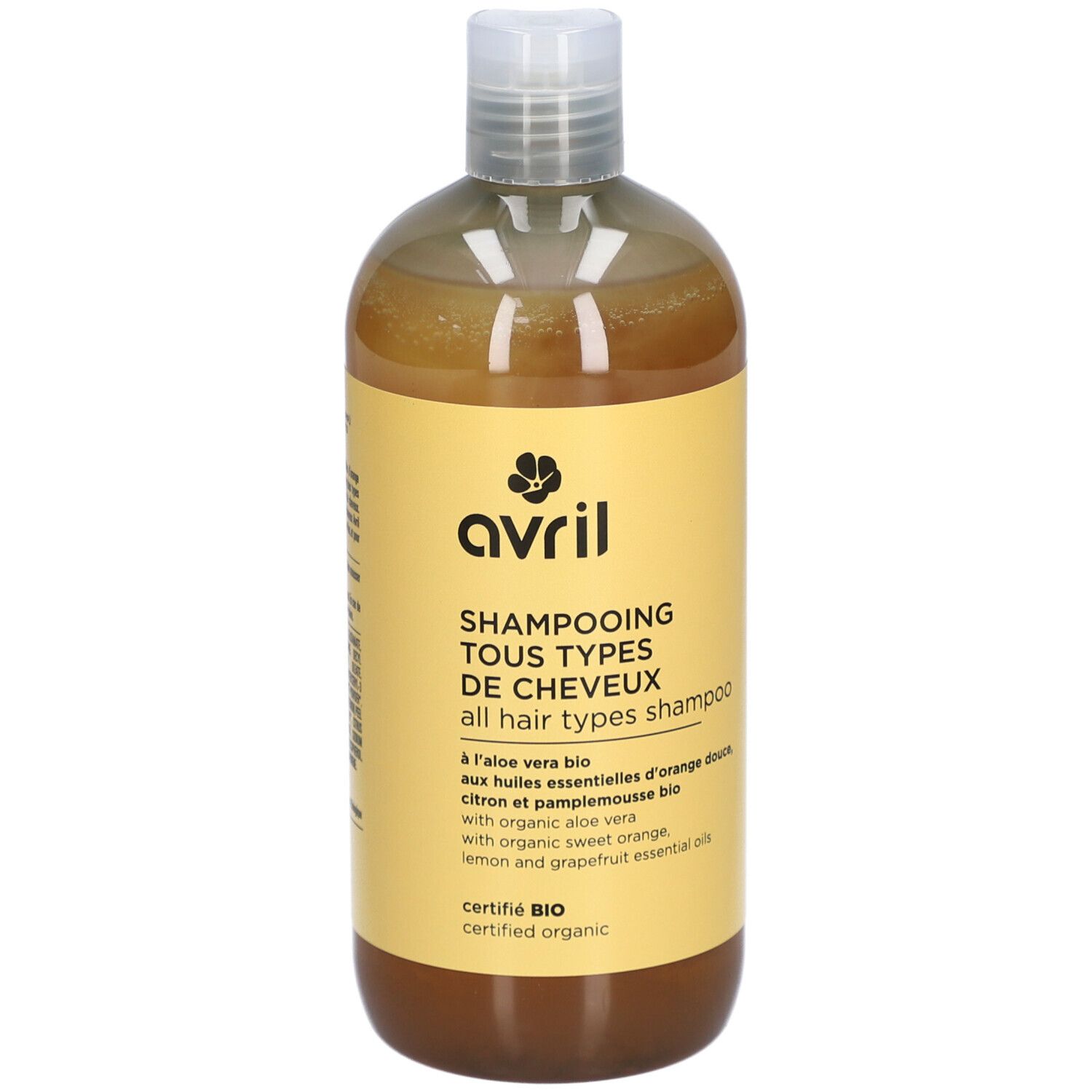 Flacon jaune Avril, Shampooing Tous Types de Cheveux. Ingrédients bio. Bouchon blanc et liquide ambré.