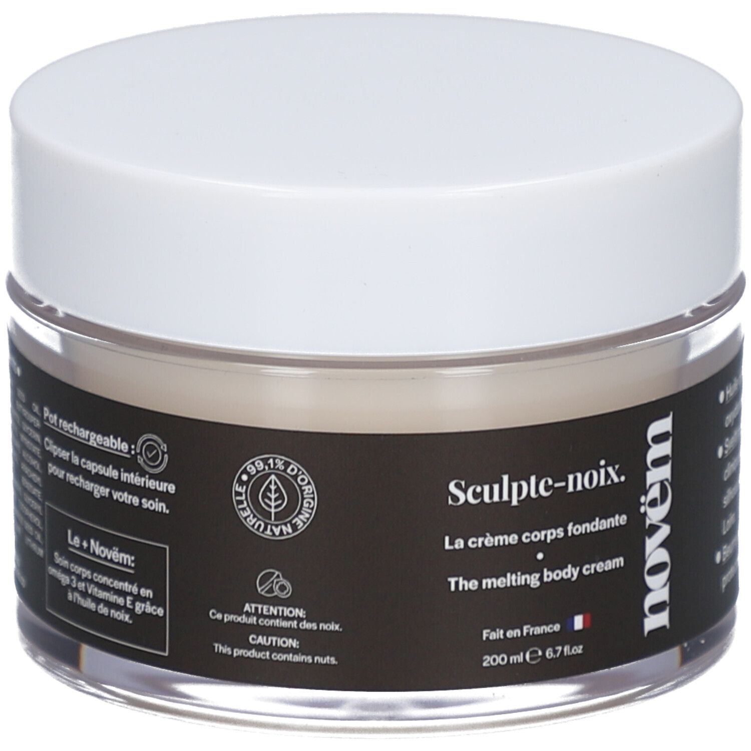 Crèmepot met witte deksel. Zwart etiket met tekst: Sculpt-noix, La crème corps fondante, novëm. 200 ml. Transparant glas.