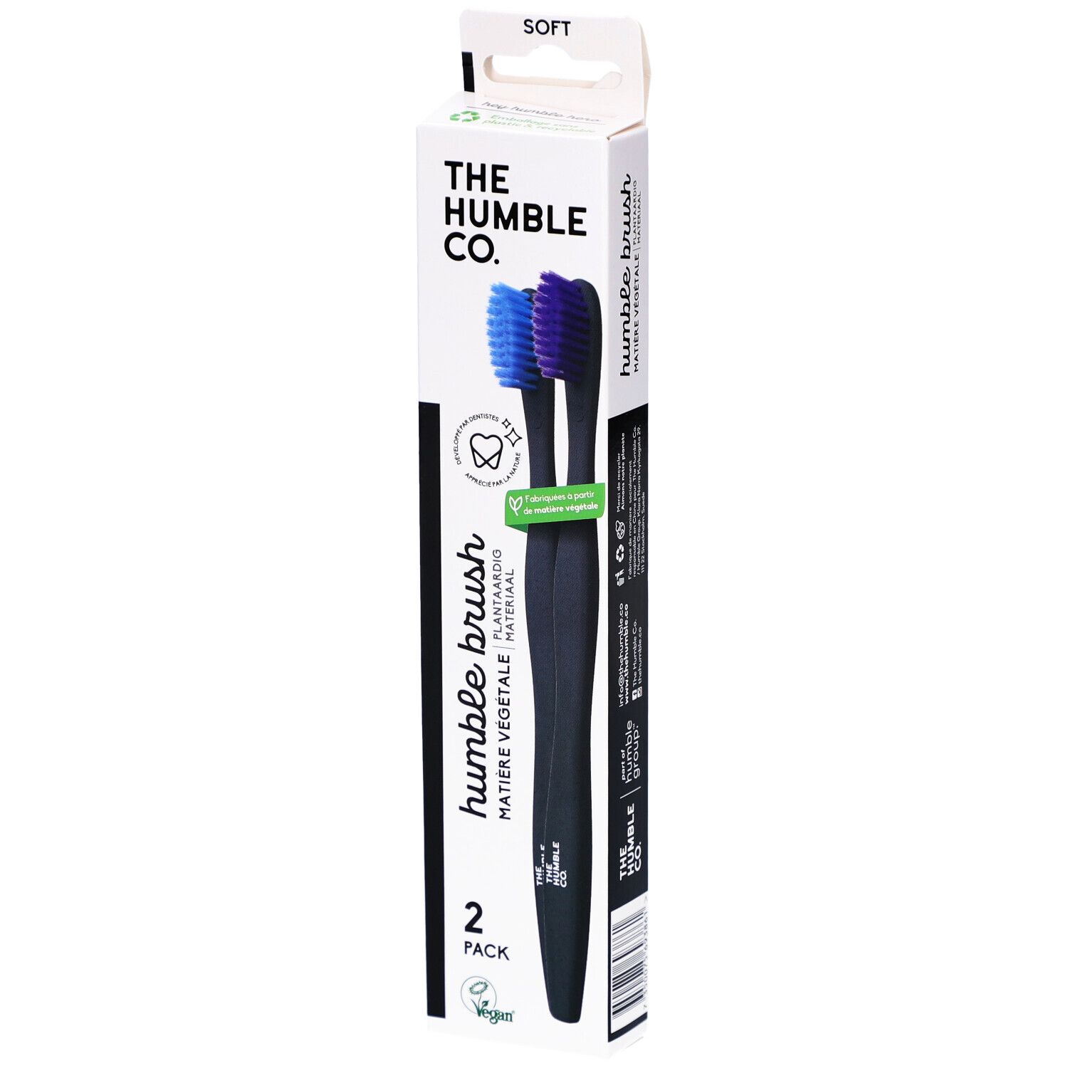 Verpakking met twee zwarte tandenborstels. Blauwe en paarse borstelharen. Opschrift: Humble Brush, 2-pack.