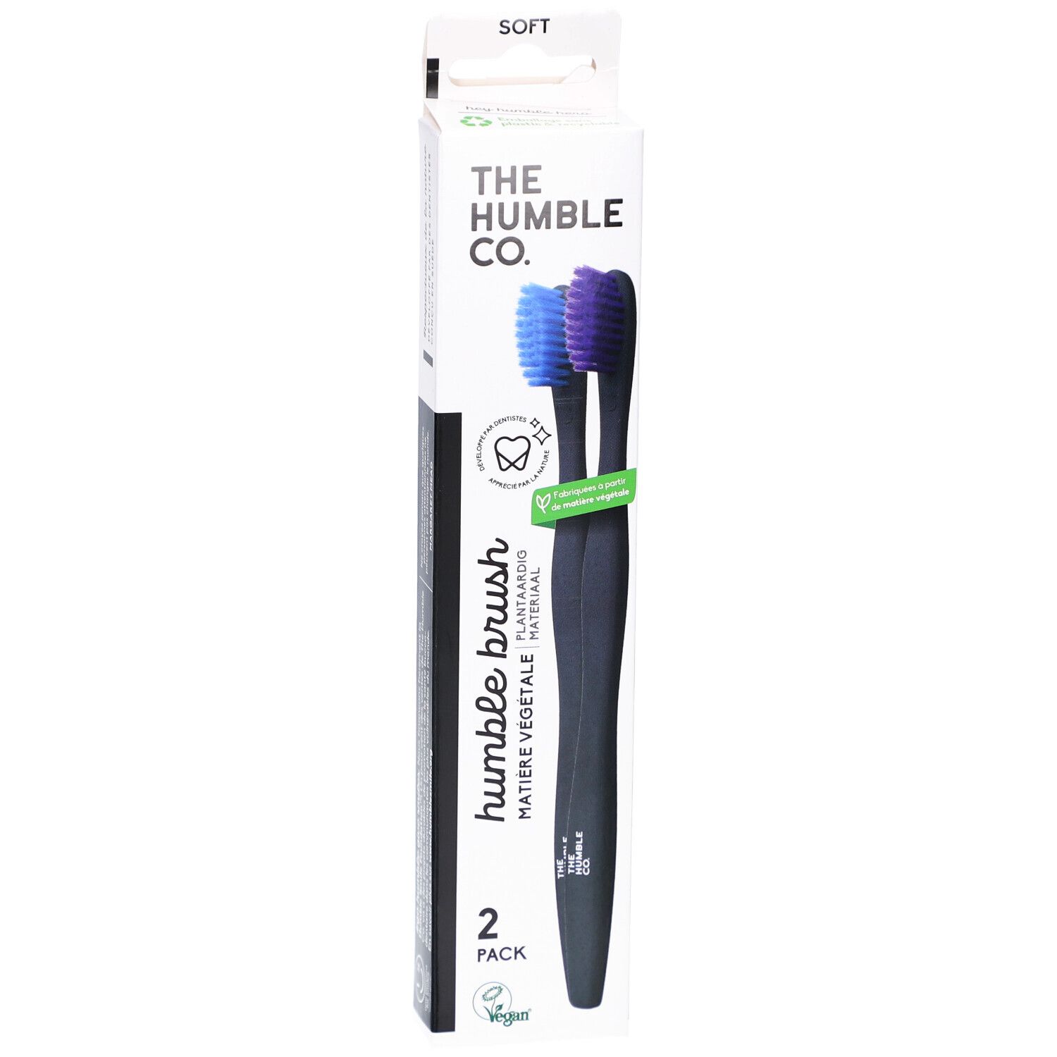 Verpakking met twee zwarte tandenborstels. Blauwe en paarse borstelharen. Opschrift: Humble Brush, 2-pack.