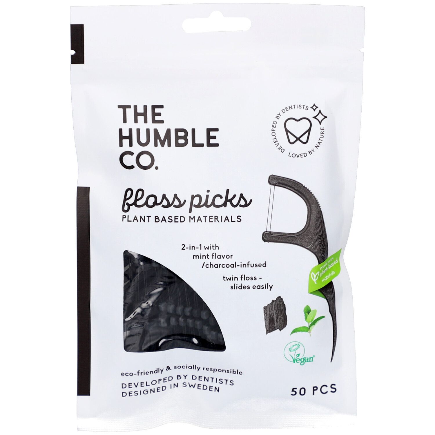 Witte verpakking met zwarte tandenstokers. Tekst: THE HUMBLE CO., Floss Picks, 50 stuks, vegan.