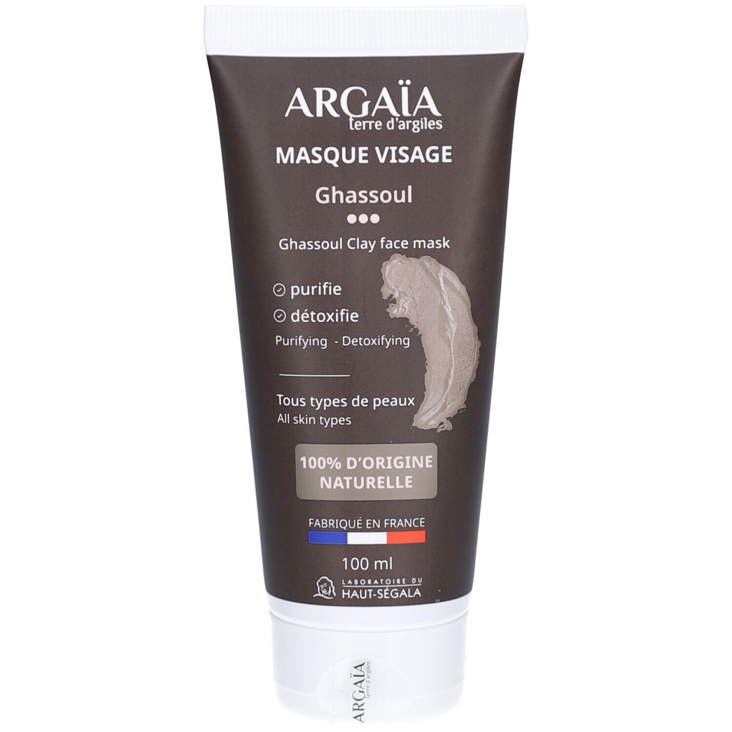 Bruine tube gezichtsmasker. Opschrift: ARGAÏA, Masque Visage Ghassoul. Tekst: Purifie, détoxifie. 100% d'origine naturelle. Gemaakt in Frankrijk.