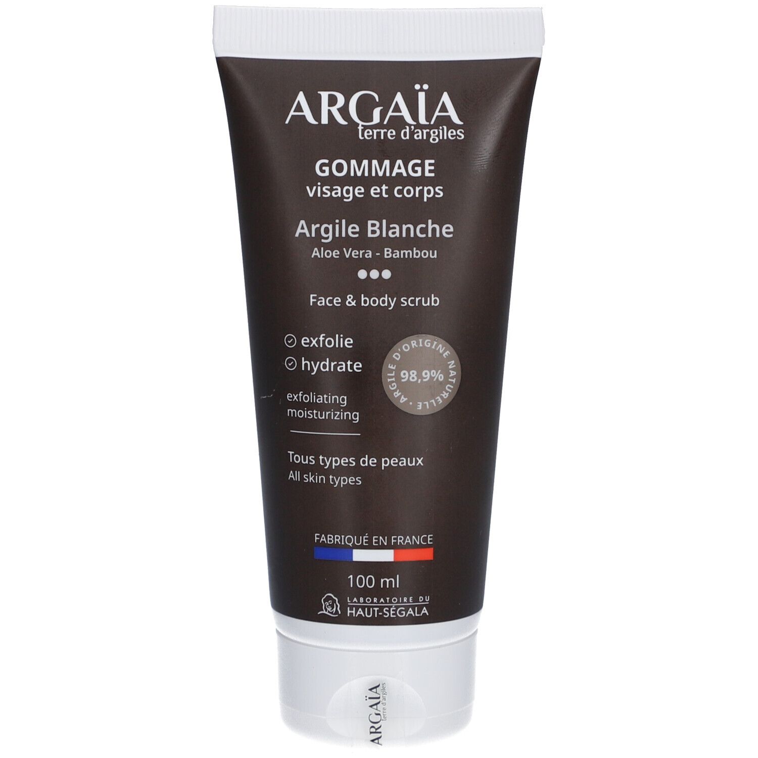 Tube lichaamsscrub. Zwarte tube met witte dop. Tekst: Argaia, Gommage Visage et Corps, Argile Blanche, 100 ml.