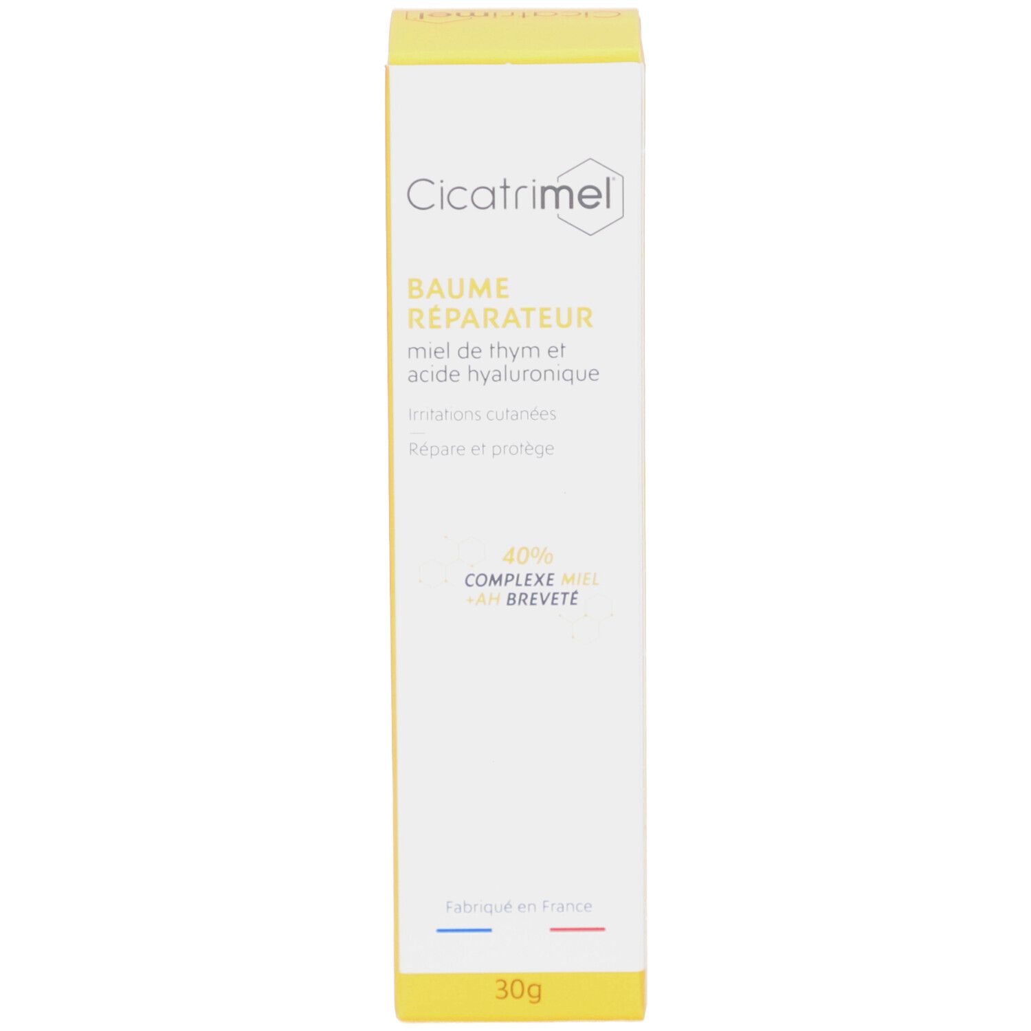 Boîte jaune avec nom du produit et logo. Texte français. En bas : 30g.