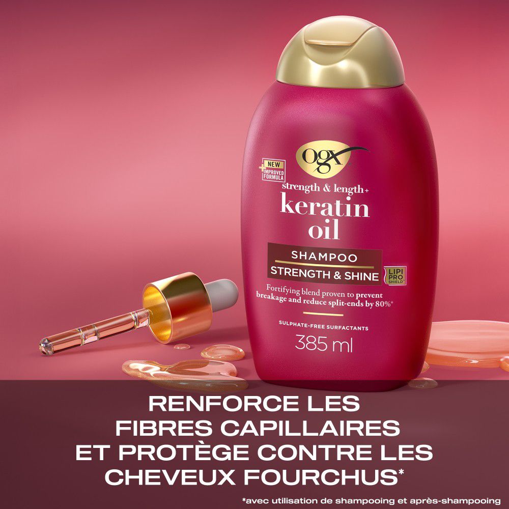 Flacon de shampooing rouge avec bouchon doré. Texte : Keratin Oil, Shampooing, 385 ml. Avec compte-gouttes.