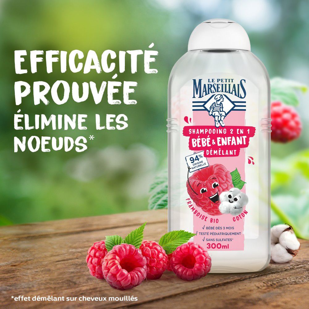 Fles op hout. Frambozen en katoen ernaast. Tekst: Efficacité Prouvée, Élimine les noeuds.