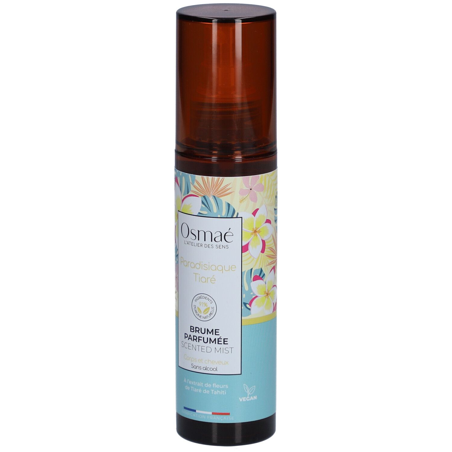 Flacon spray marron avec étiquette florale. Texte: OSMAE, Paradisiaque Tiaré, Brume Parfumée, Scented Mist. Label Vegan.