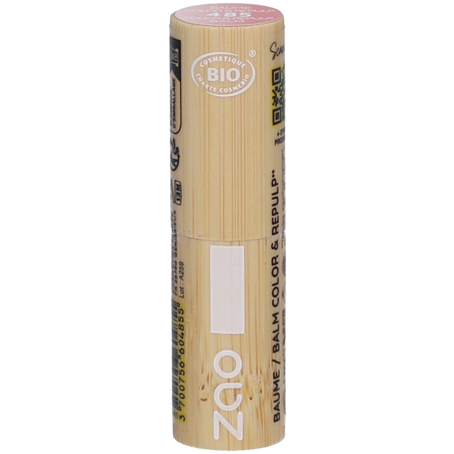 Cilindrische lippenbalsem-container van hout. Roze bovenkant, met opdrukken. Zichtbaar: ZAO-logo, BAUME / COLOR & REPULP, kleurnummer 405.