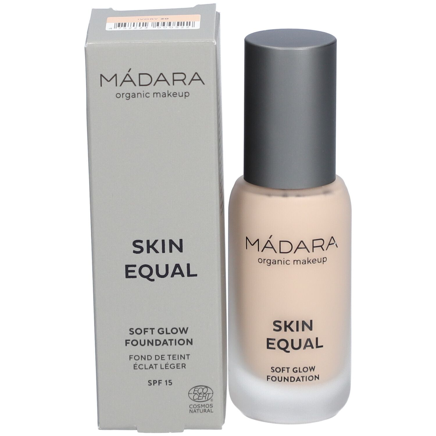 Vloeibare foundation in glazen fles en doos. Opschrift: MÁDARA, SKIN EQUAL, SOFT GLOW FOUNDATION, SPF 15. COSMOS NATURAL-certificering.