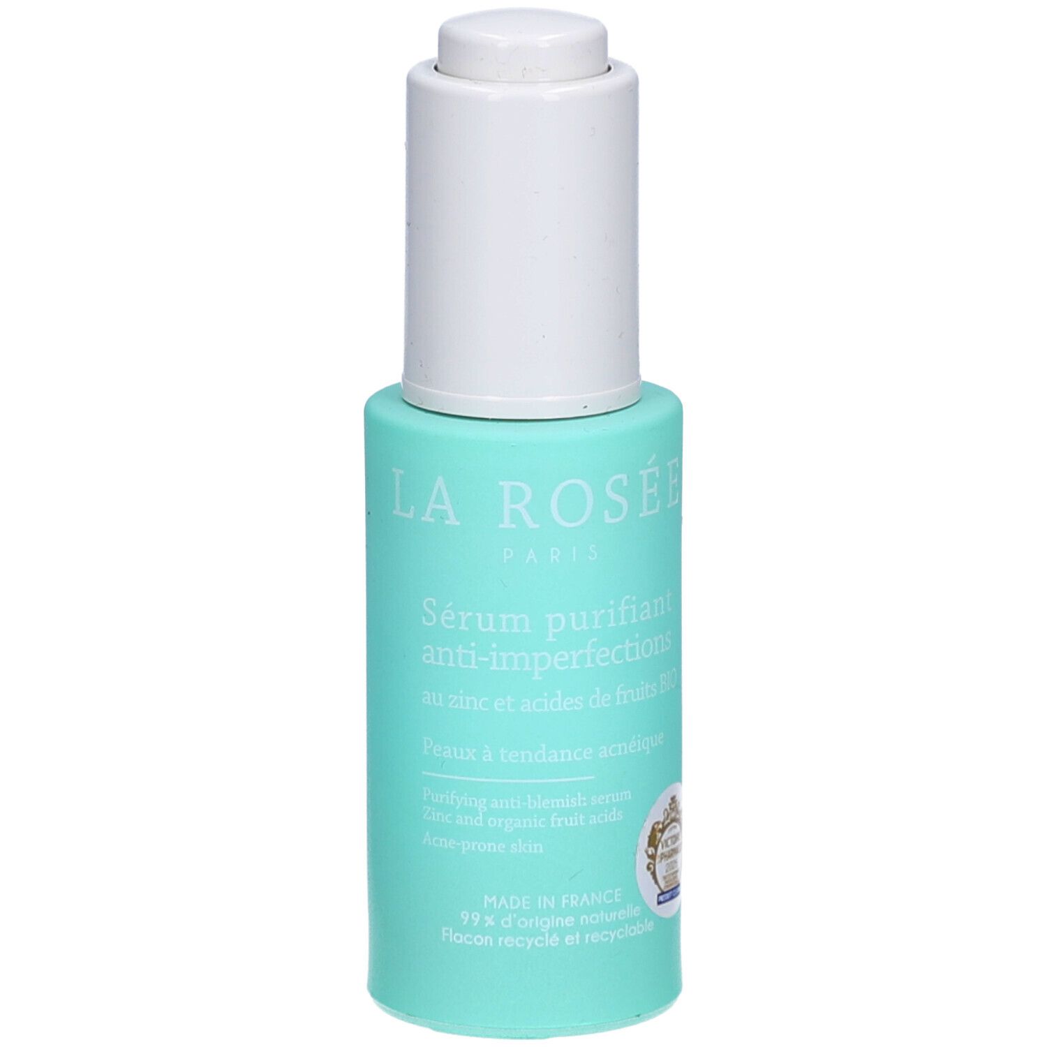 Turquoise fles met witte dop. Opschrift: La Rosée Paris, Sérum purifiant anti-imperfections. Certificeringslogo zichtbaar.