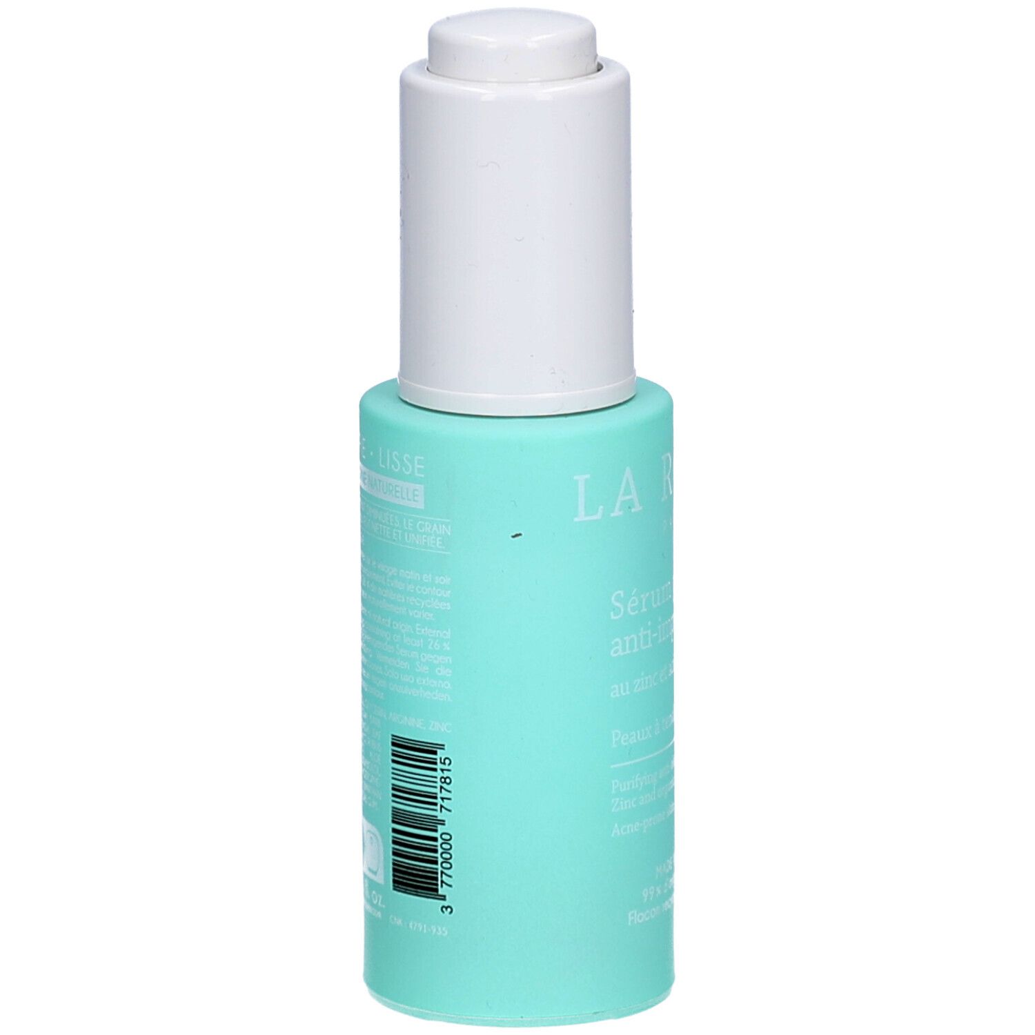 Turquoise fles met witte dop. Achterkant met tekst en barcode. Productnaam niet zichtbaar.