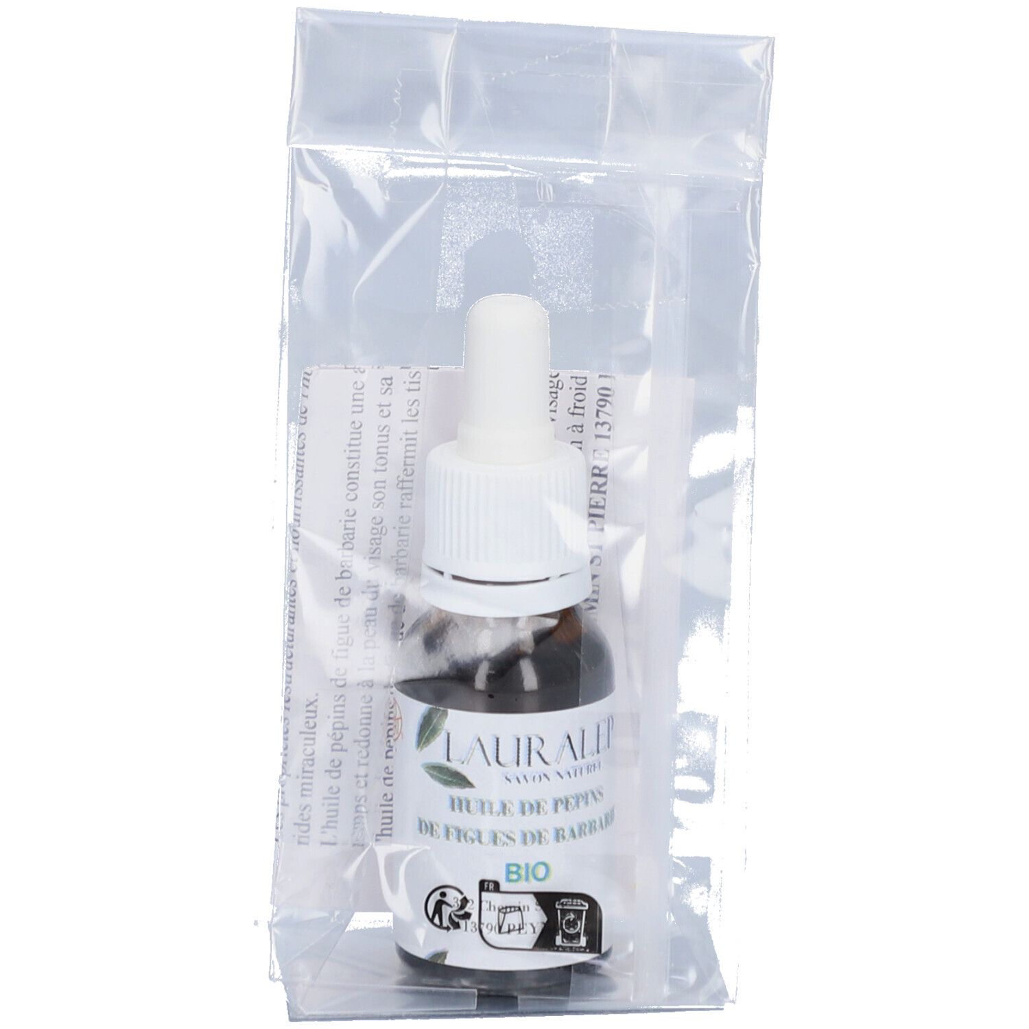 Bruine glazen fles met pipet in plastic verpakking. Etiket met productnaam en bio-keurmerk.