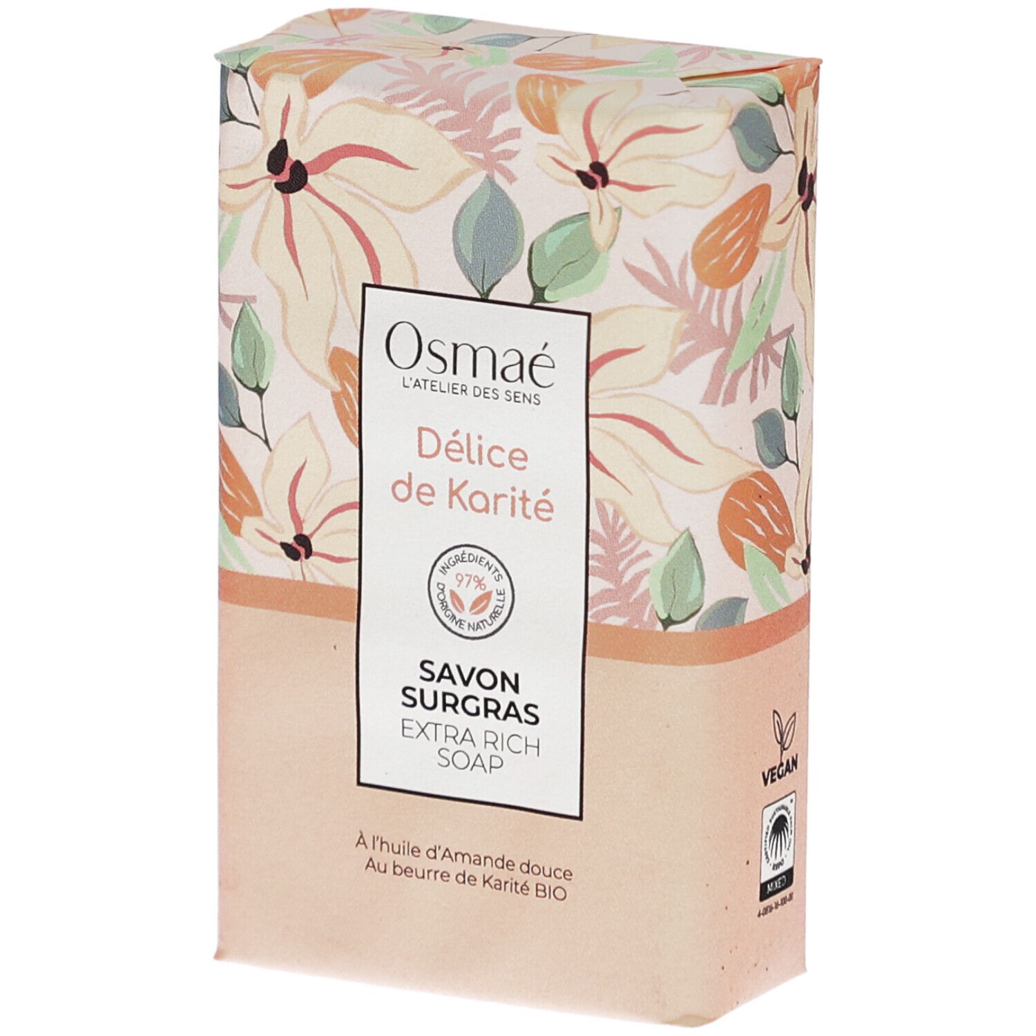 Rechthoekige zeep in verpakking. Opschrift: Osmaé, Délicé de Karité, Savon Surgras, Extra Rich Soap. Bloemenpatroon.