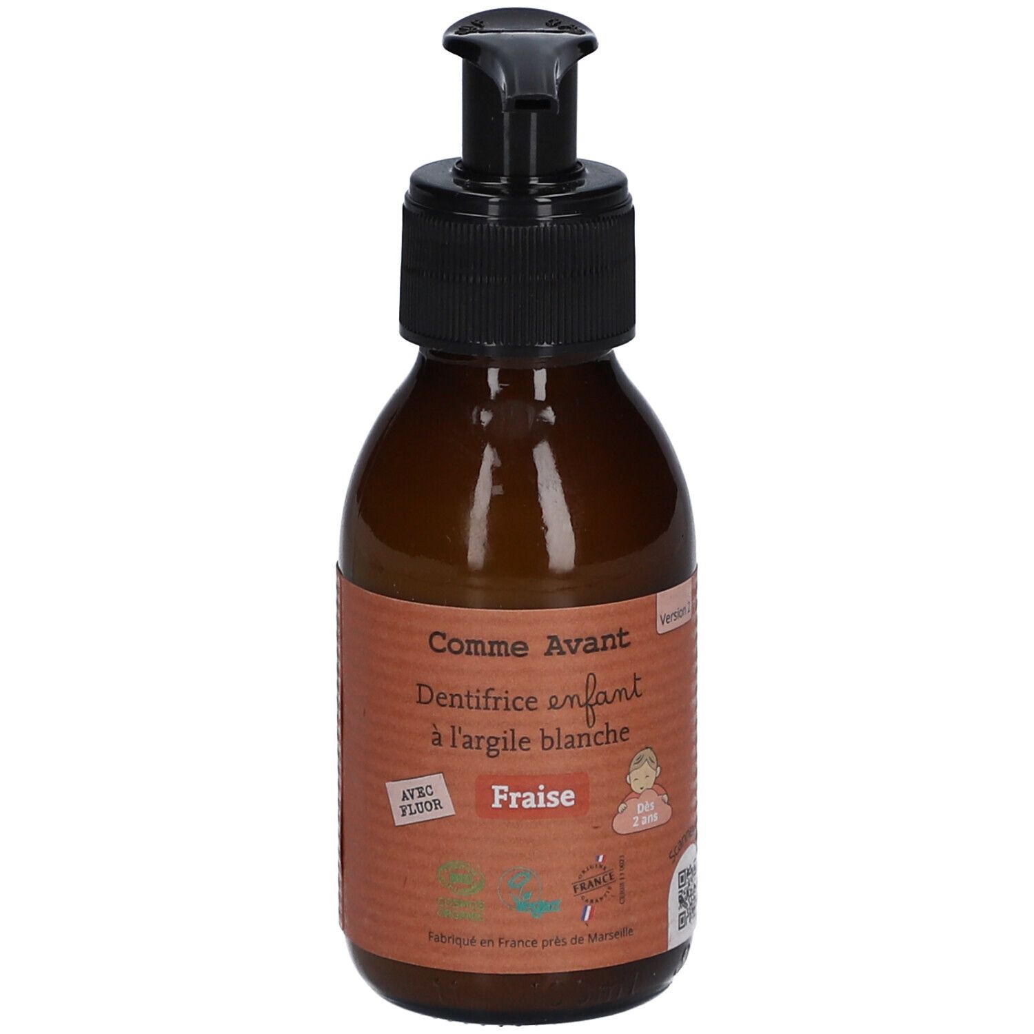 Bruine fles met zwarte pomp. Opschrift: Comme Avant, Dentifrice enfant à l'argile blanche Fraise. Met Fluor.