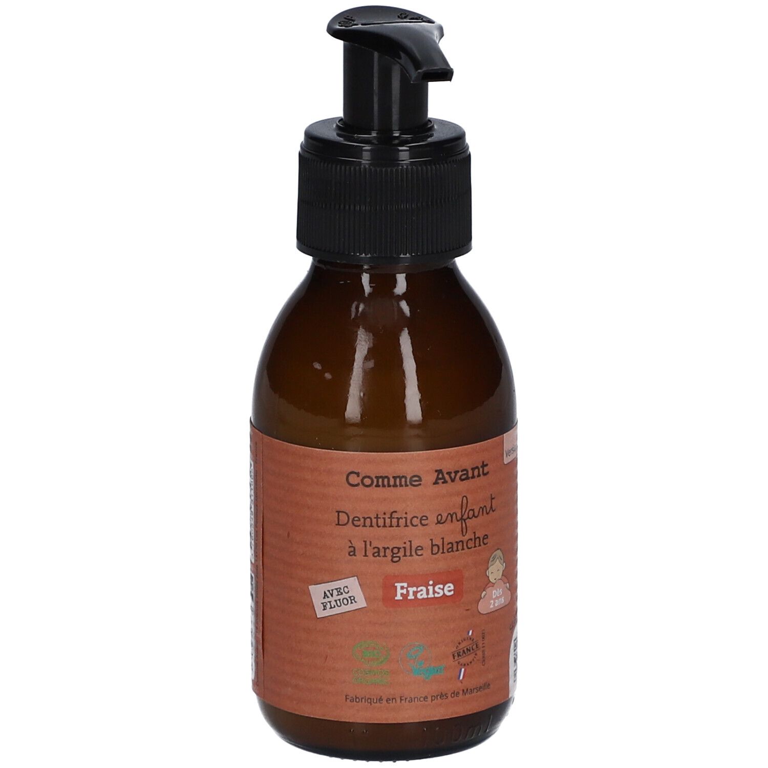 Bruine fles met zwarte pomp. Opschrift: Comme Avant, Dentifrice enfant à l'argile blanche Fraise. Met Fluor.