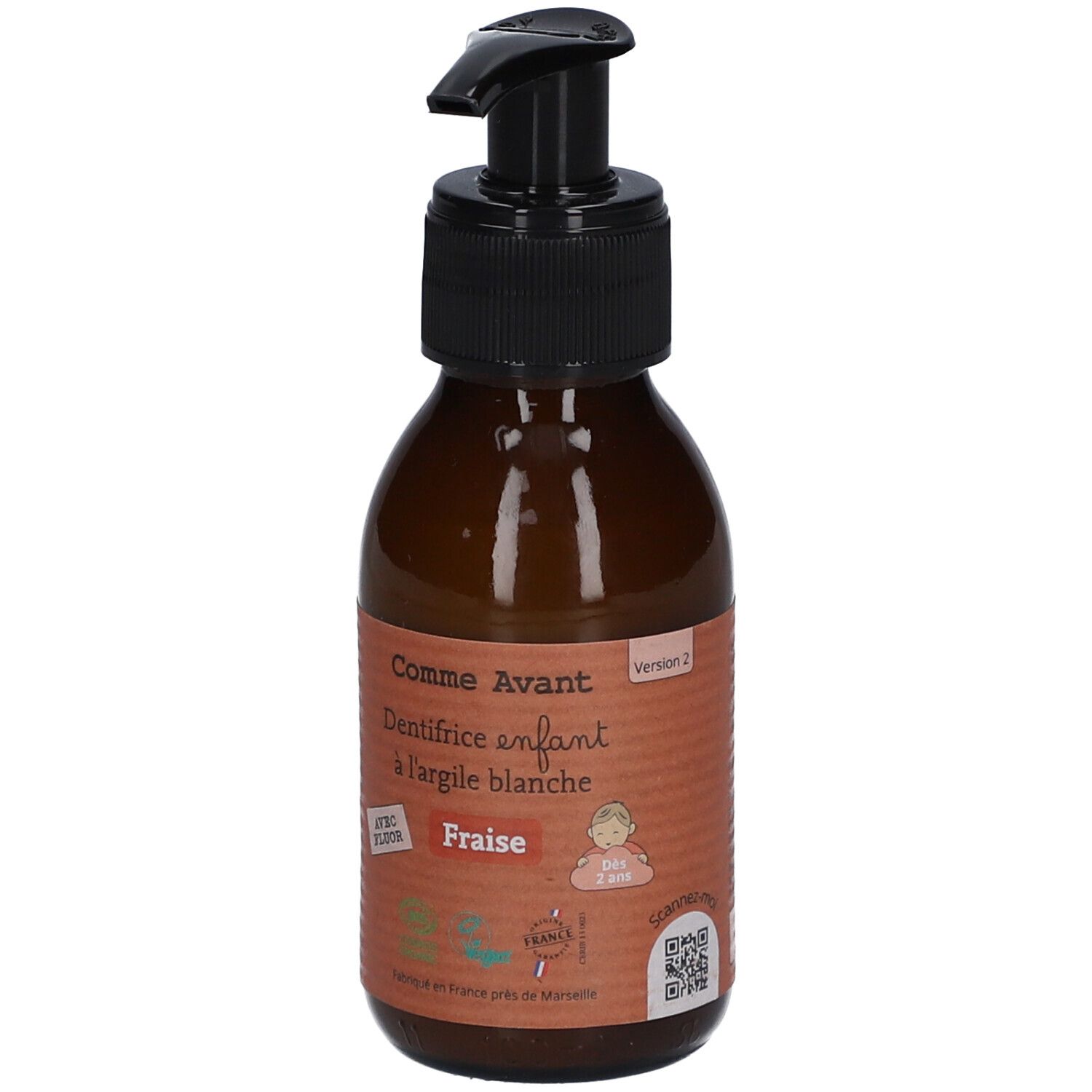 Bruine fles met zwarte pomp. Opschrift: Comme Avant, Dentifrice enfant à l'argile blanche Fraise. Met Fluor.