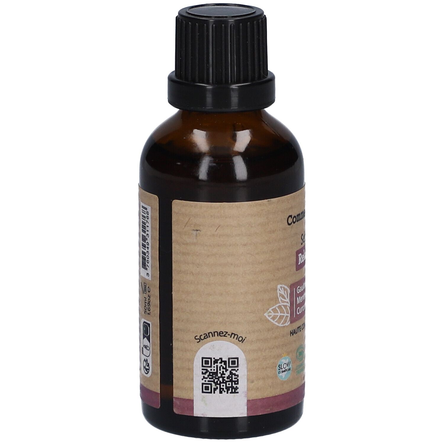 Achterkant van een bruine glazen fles. Etiket met QR-code en tekst. "Comme Avant" en "Sérum Relaxant".