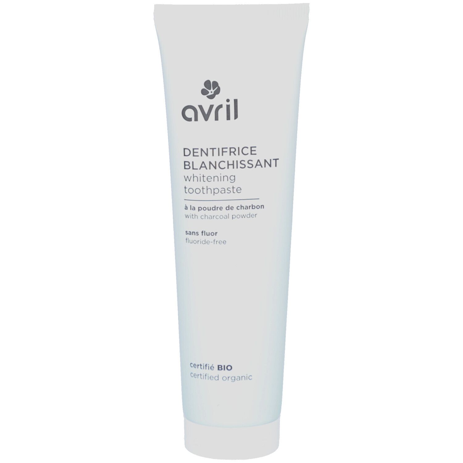 Witte tandpastatube met zwarte opdruk. Opschrift: Avril, Dentifrice Blanchissant, whitening toothpaste, à la poudre de charbon, certifié BIO.