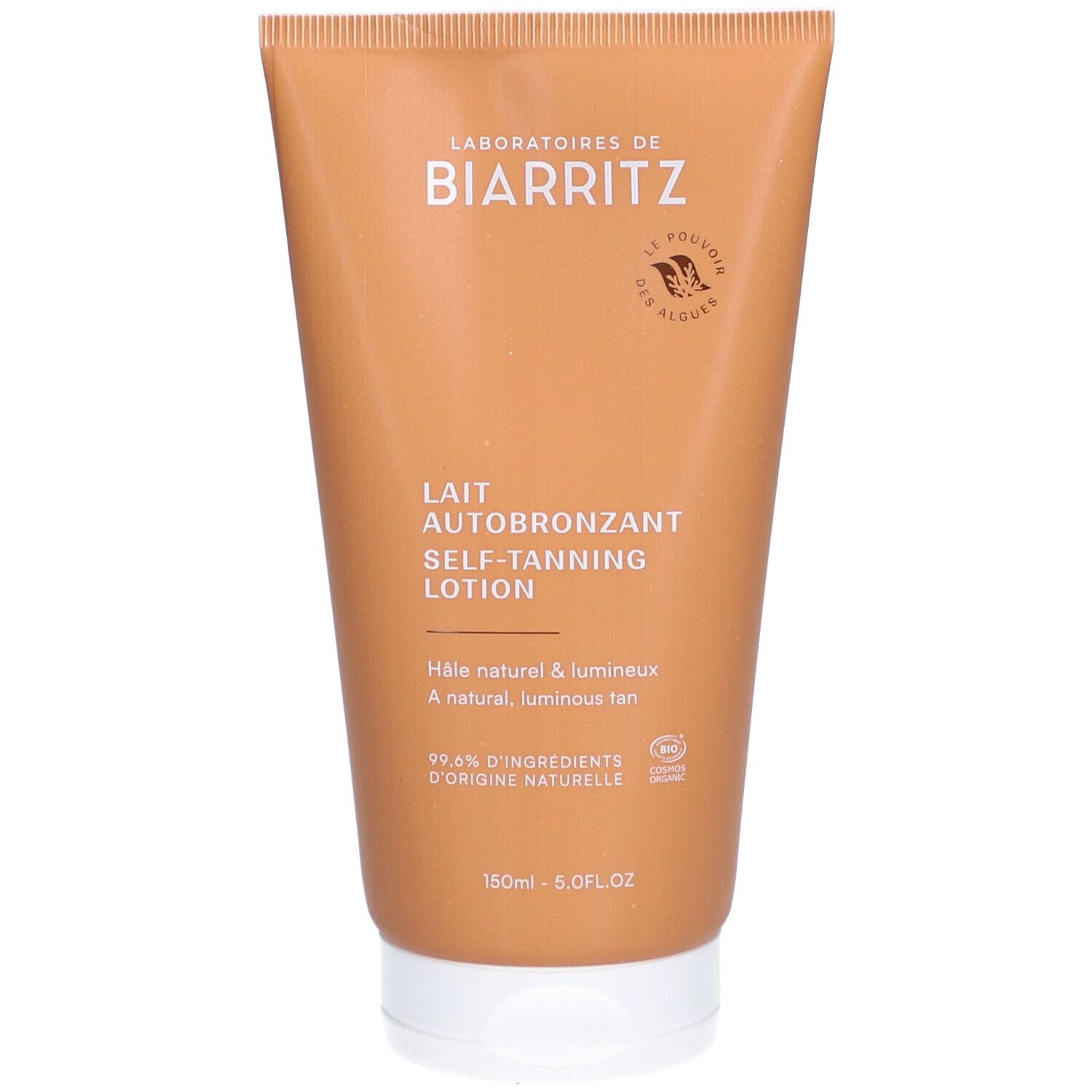 Beige tube met witte dop. Opschrift: Laboratoires de Biarritz, Lait Autobronzant. Bio-certificering.