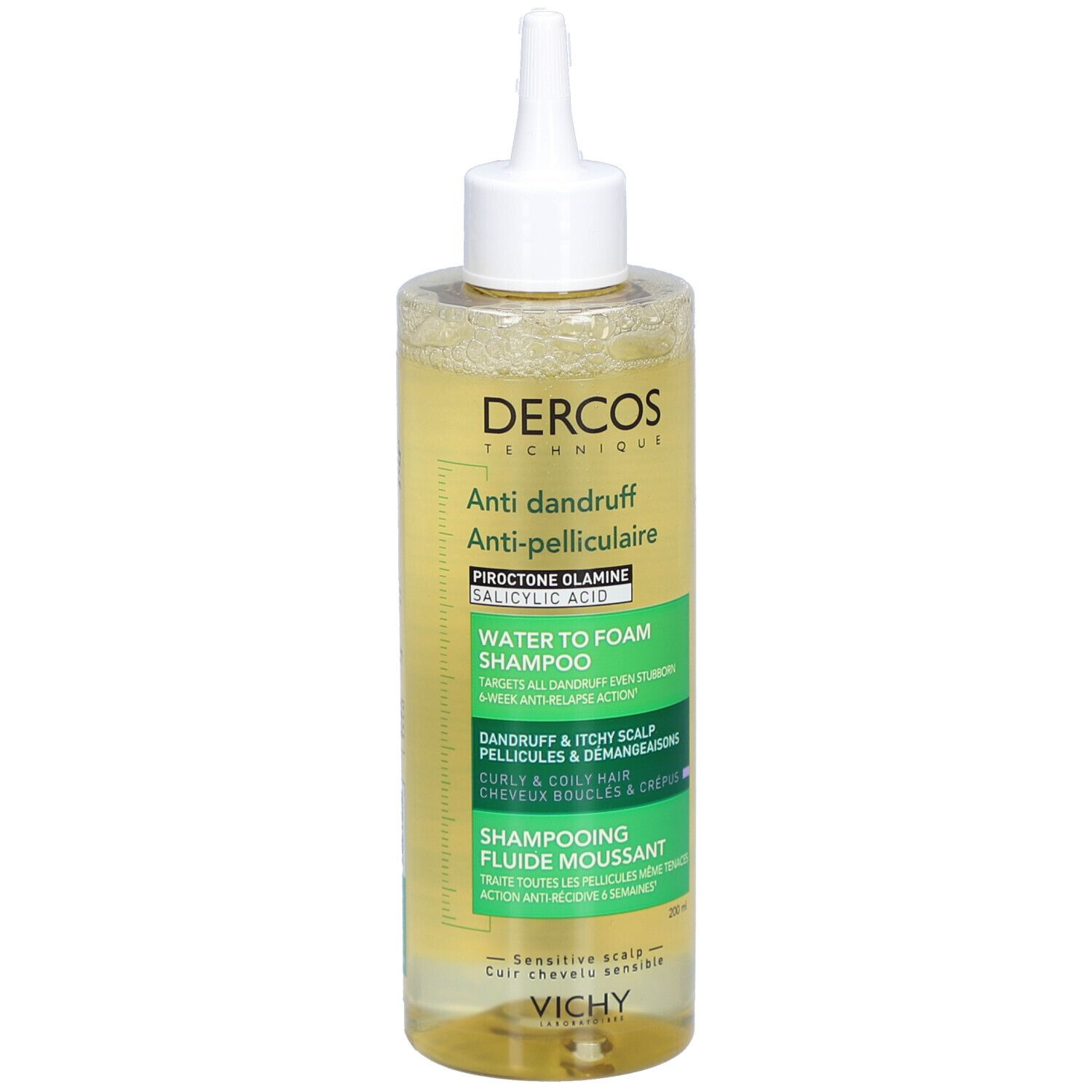Shampooing liquide clair en flacon transparent avec applicateur blanc. Inscriptions: DERCOS, Anti-pelliculaire, Shampooing eau-mousse.
