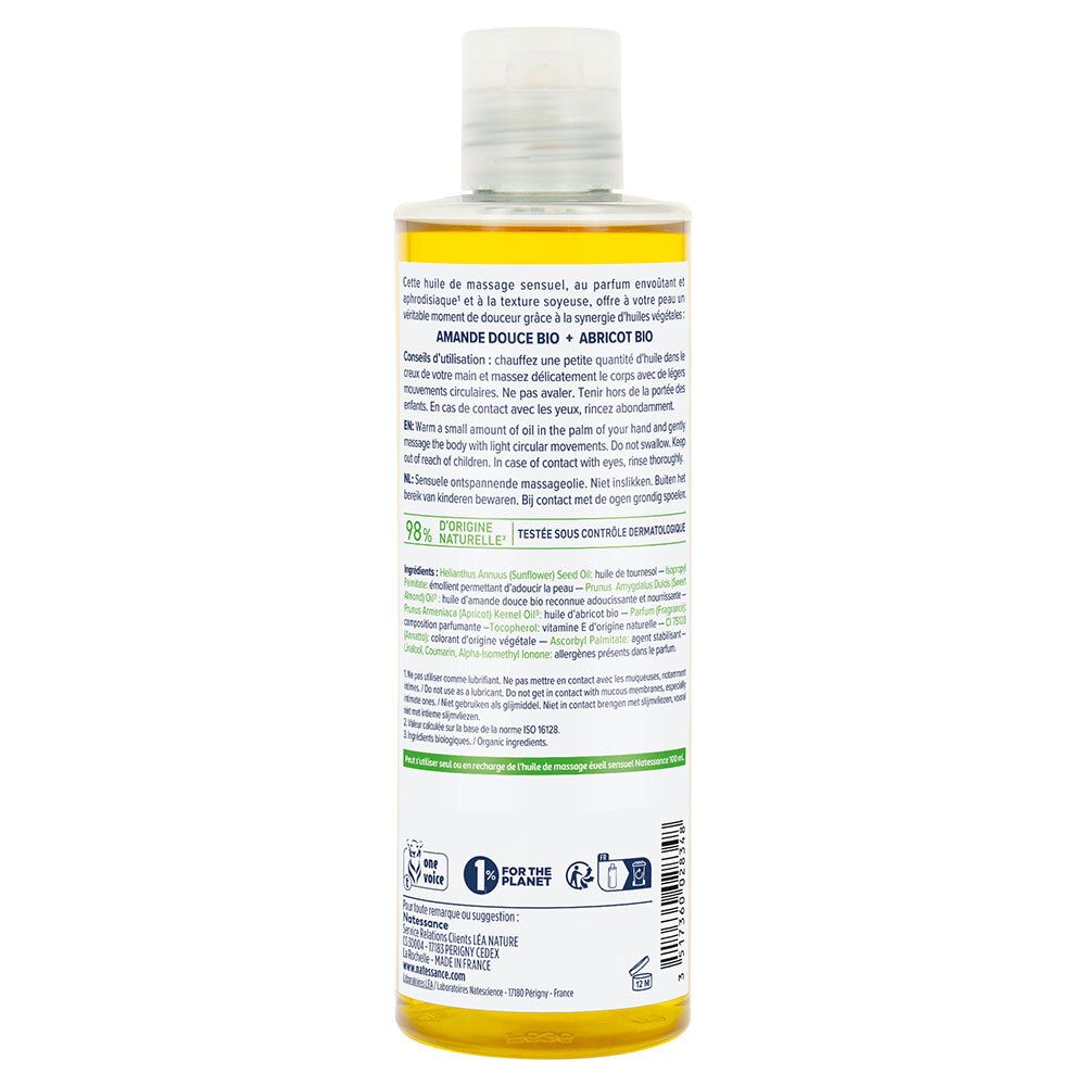 Achterkant van de massageoliefles. Tekst: Zoete amandelolie, abrikozenpitolie. 98% natuurlijke ingrediënten.