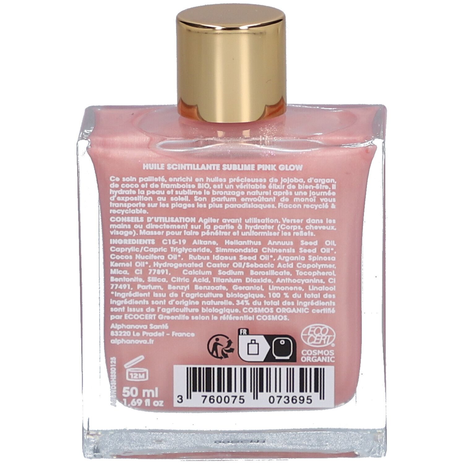 Achterkant van de glazen fles met roze olie. Tekst: ingrediënten, 50 ml, certificeringen.