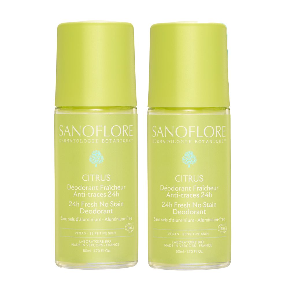 Twee roll-on deodorants. Groen-gele flessen met doppen. Tekst: Sanoflore, Citrus, 24H Fresh No Stain Deodorant.