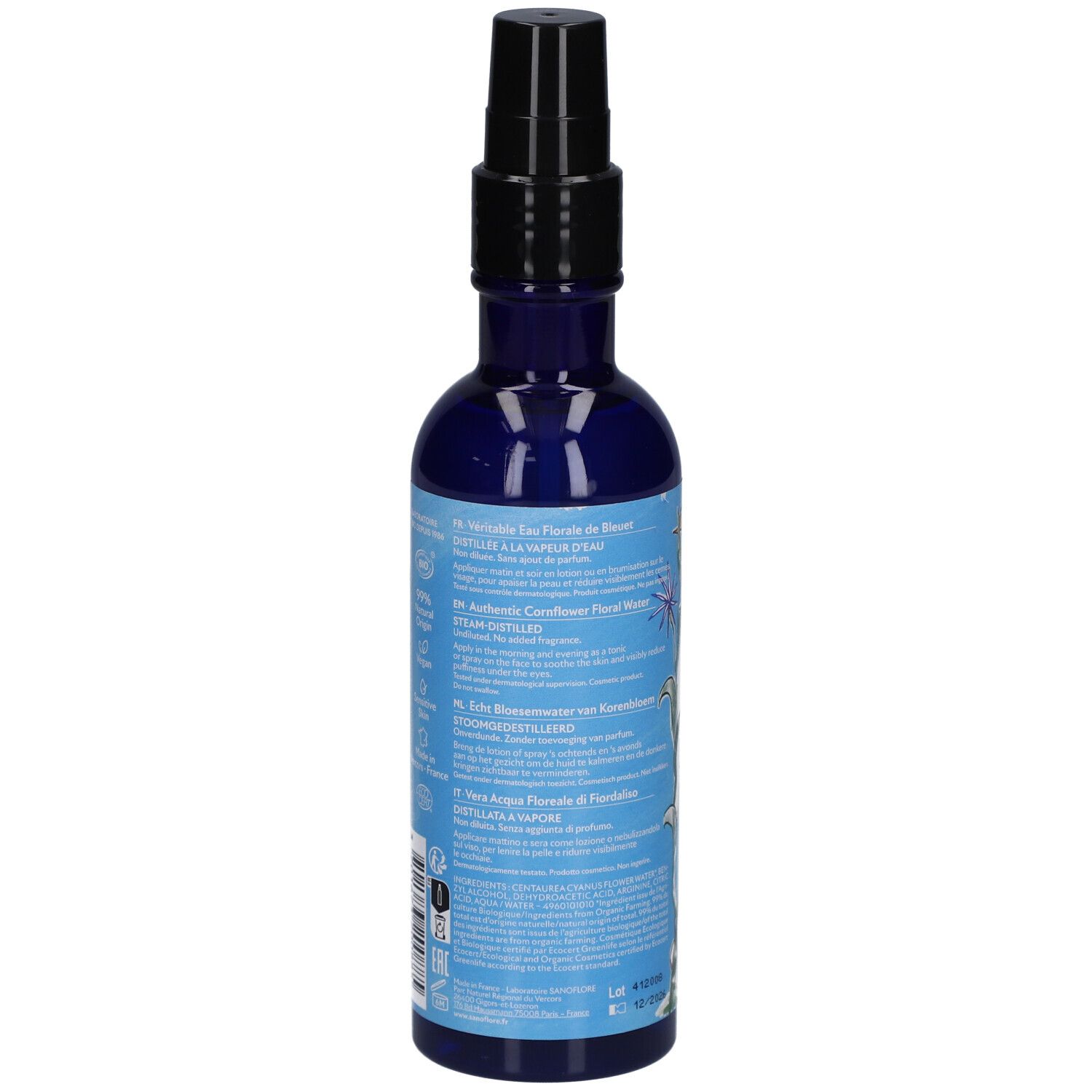 Dos d'un flacon bleu avec vaporisateur noir. Texte en plusieurs langues.