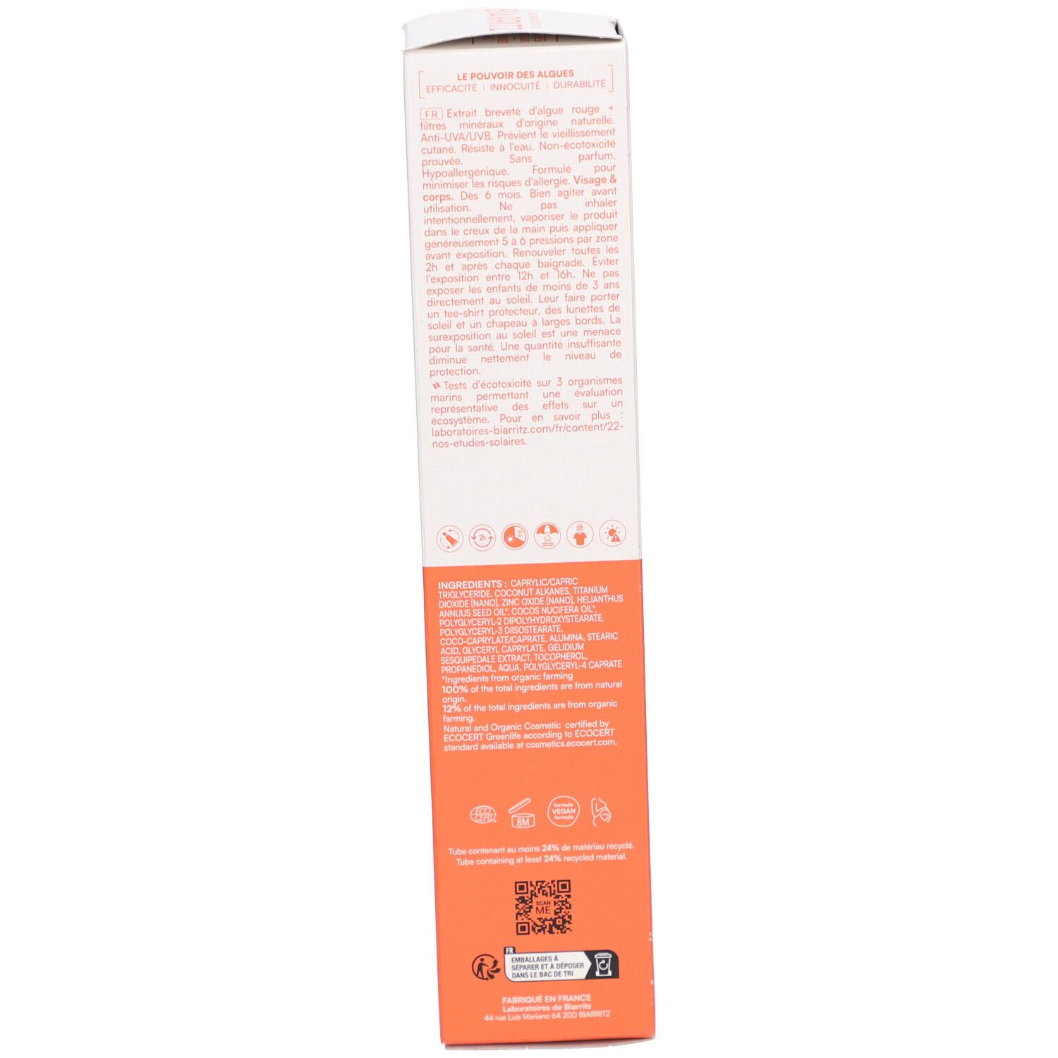 Emballage de crème solaire, côté. Texte et logos sur fond orange.