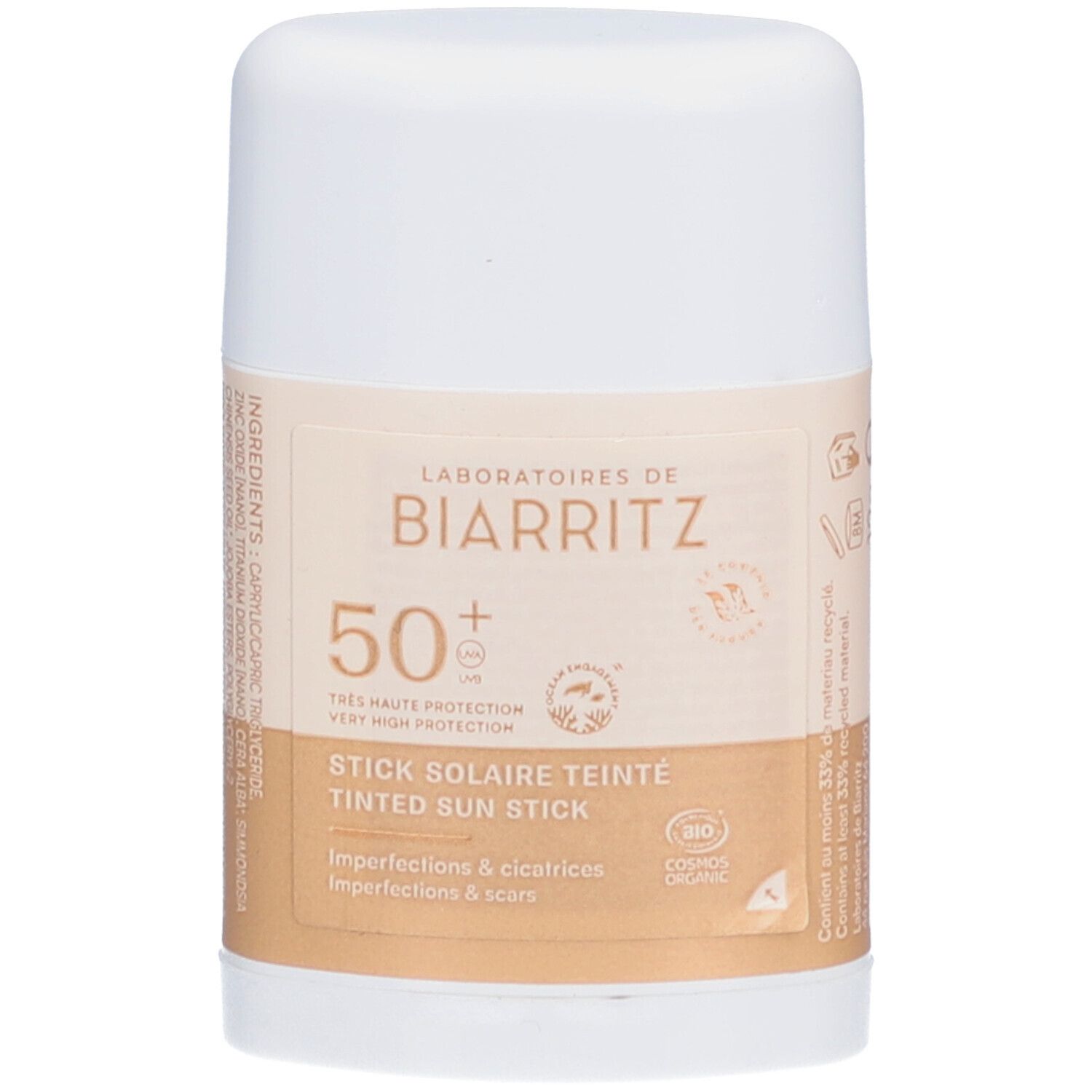 Stick solaire teinté blanc et beige. Inscriptions: LABORATOIRES DE BIARRITZ, 50+, STICK SOLAIRE TEINTE, Imperfections & cicatrices.