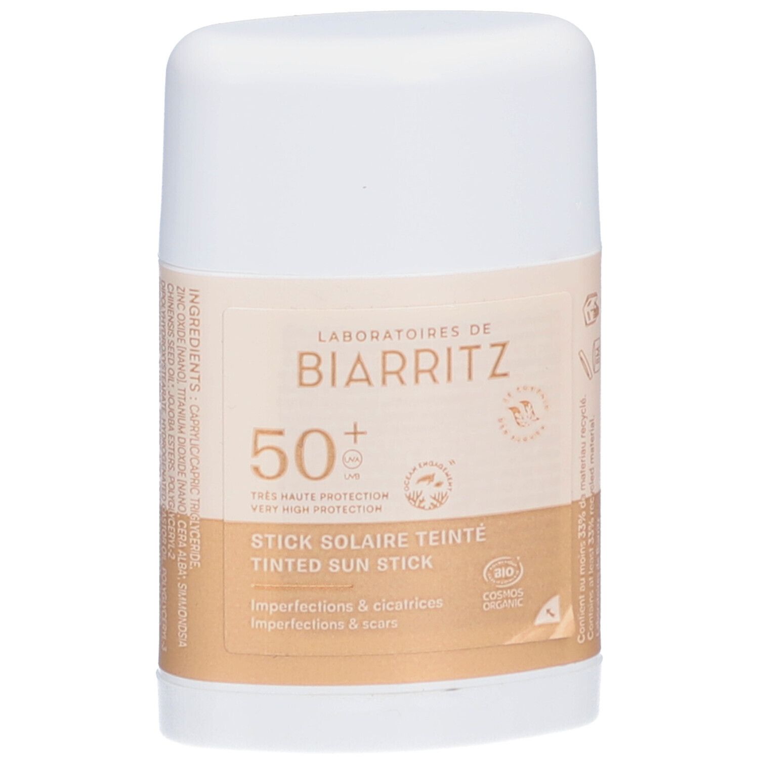 Stick blanc avec inscription beige. Texte: LABORATOIRES DE BIARRITZ, 50+, STICK SOLAIRE TEINTE, Imperfections & cicatrices.