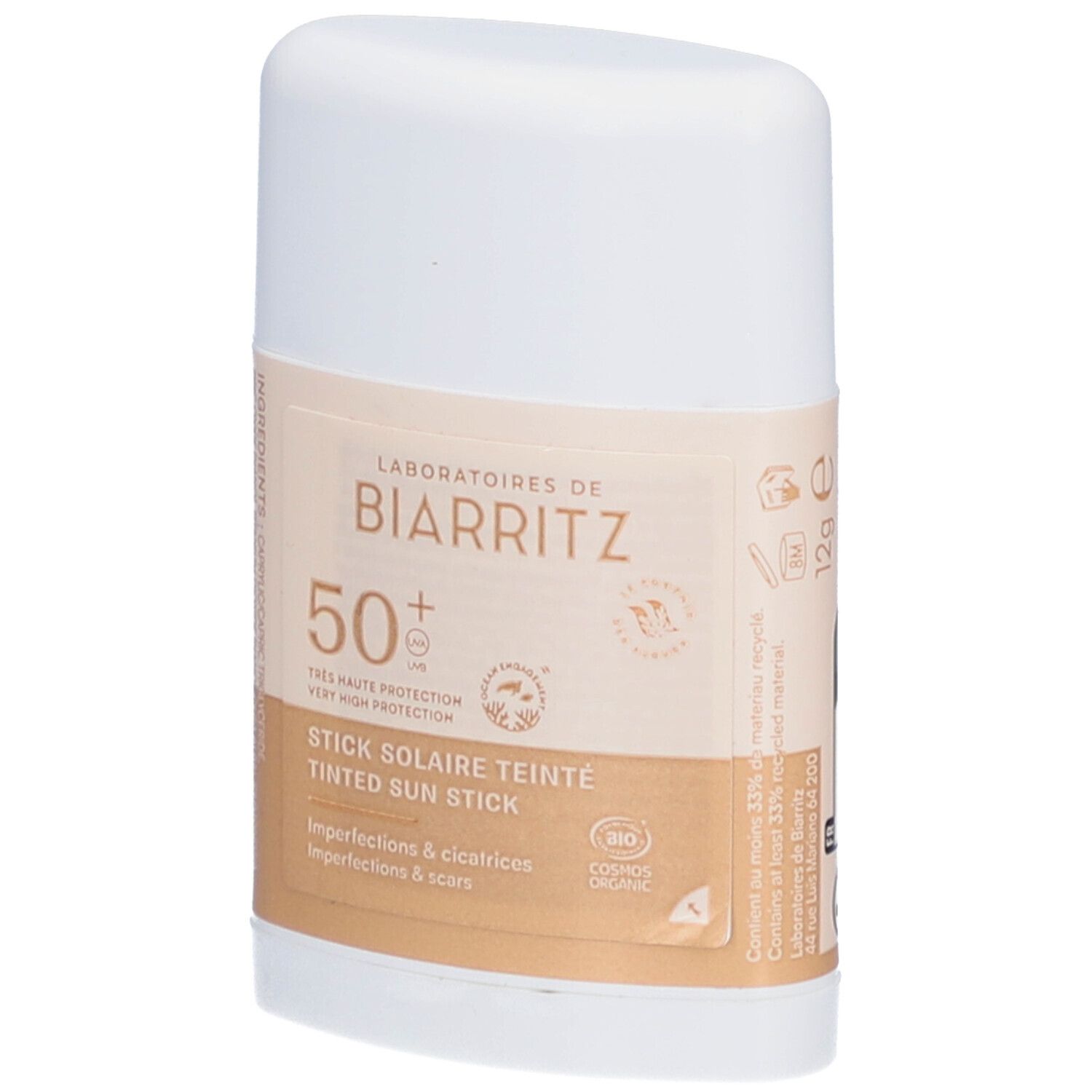 Stick blanc avec inscription beige. Texte: LABORATOIRES DE BIARRITZ, 50+, STICK SOLAIRE TEINTE, Imperfections & cicatrices.
