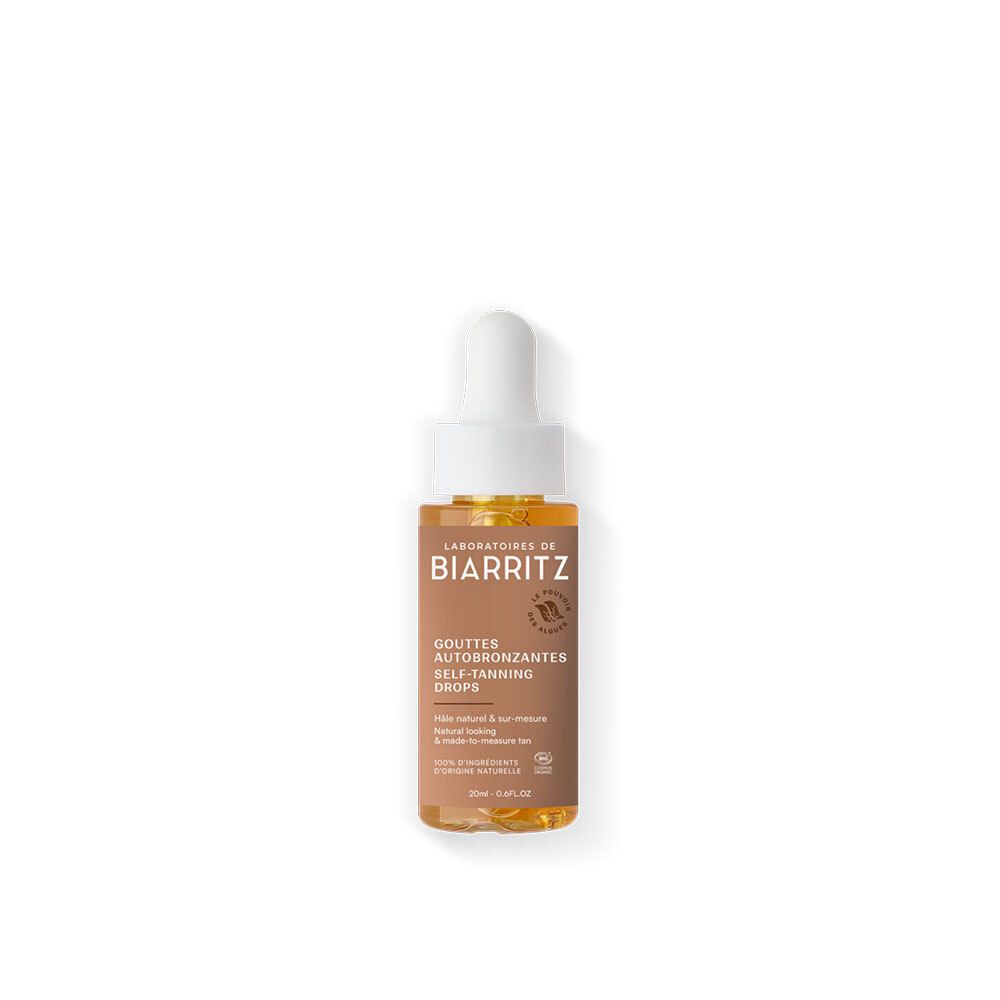 Bruine glazen fles met pipet. Opschrift: BIARRITZ, GOUTTES AUTOBRONZANTES, SELF-TANNING DROPS. Bevat 100% ingrediënten van natuurlijke oorsprong.