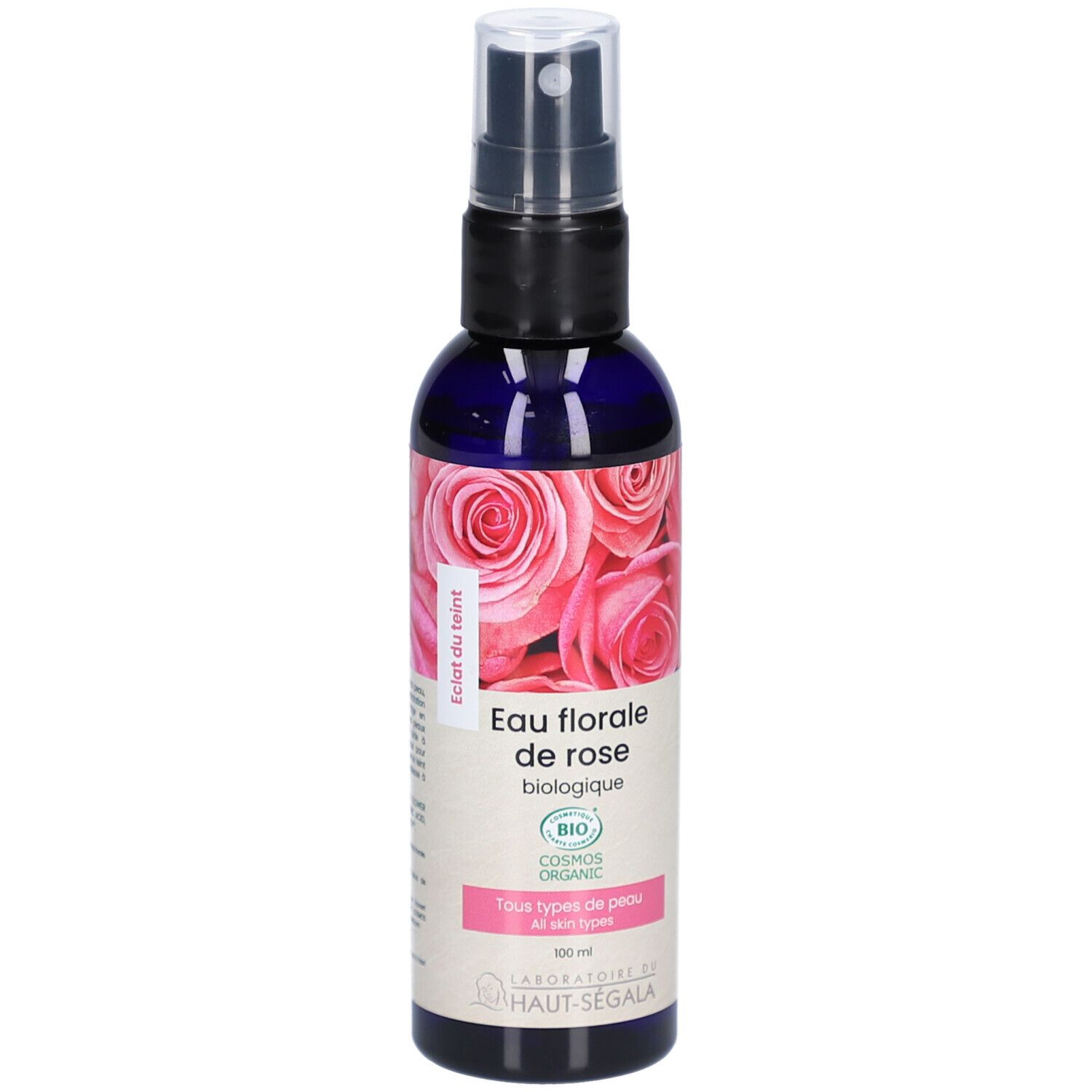 Blauwe transparante fles met verstuiver. Etiket met rozenmotief en tekst: Eau florale de rose biologique. Bio-certificering.