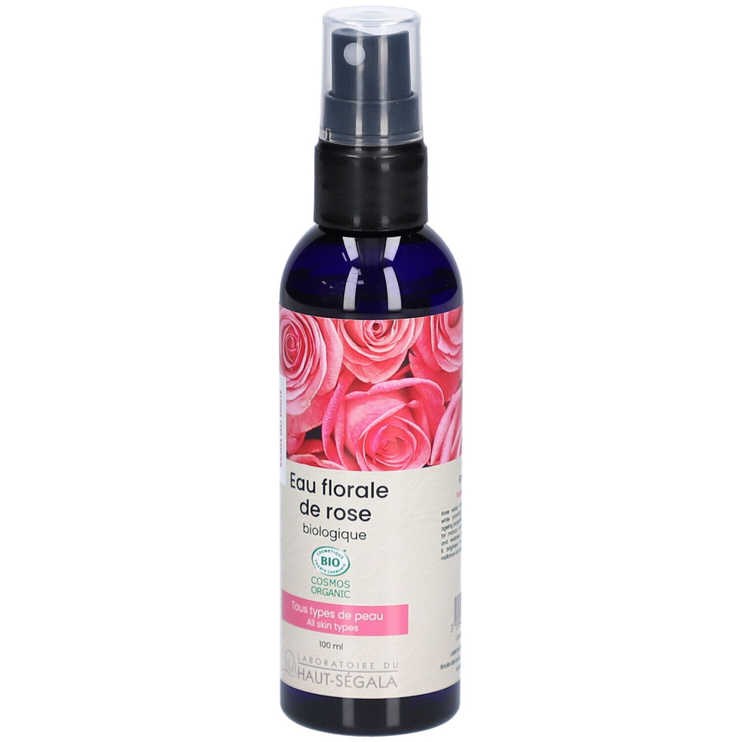 Blauwe transparante fles met verstuiver. Etiket met rozenmotief en tekst: Eau florale de rose biologique. Bio-certificering.