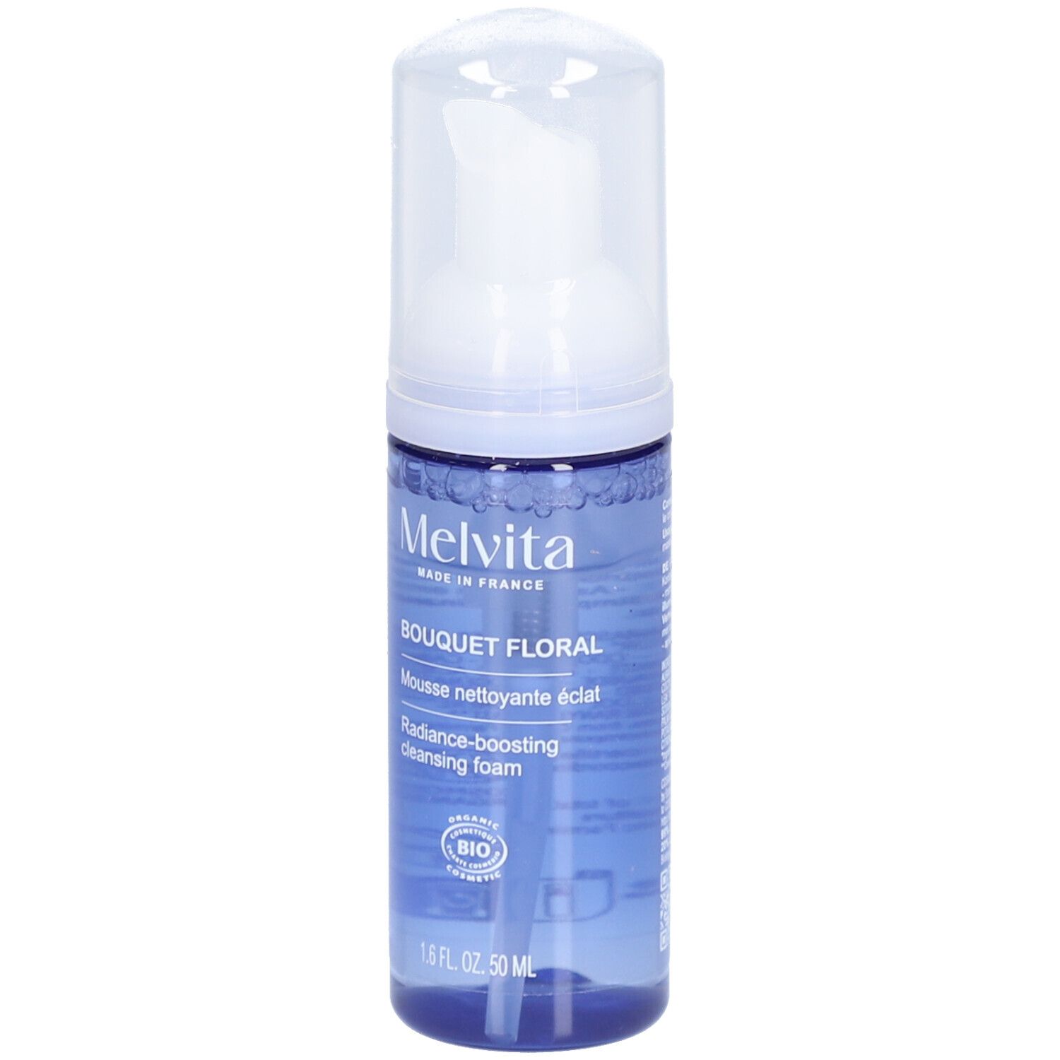 Blauwe transparante fles met witte pomp. Opschrift: MELVITA, Bouquet Floral, Mousse nettoyante éclat, Radiance-boosting cleansing foam.