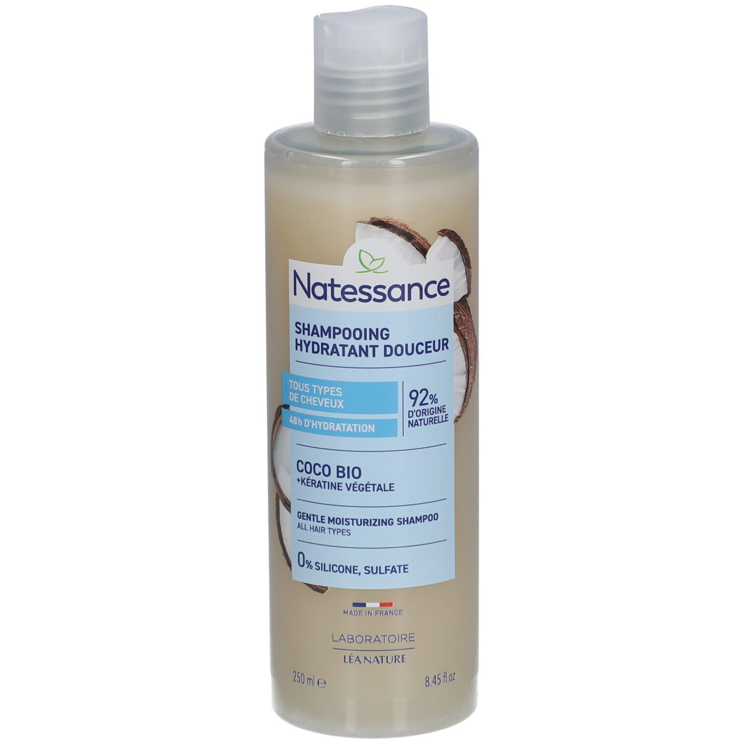 Flacon de shampooing. Inscription: NATESSANCE, Shampoing hydratant douceur, Coco Bio. 92% d'ingrédients naturels. Tous types de cheveux.