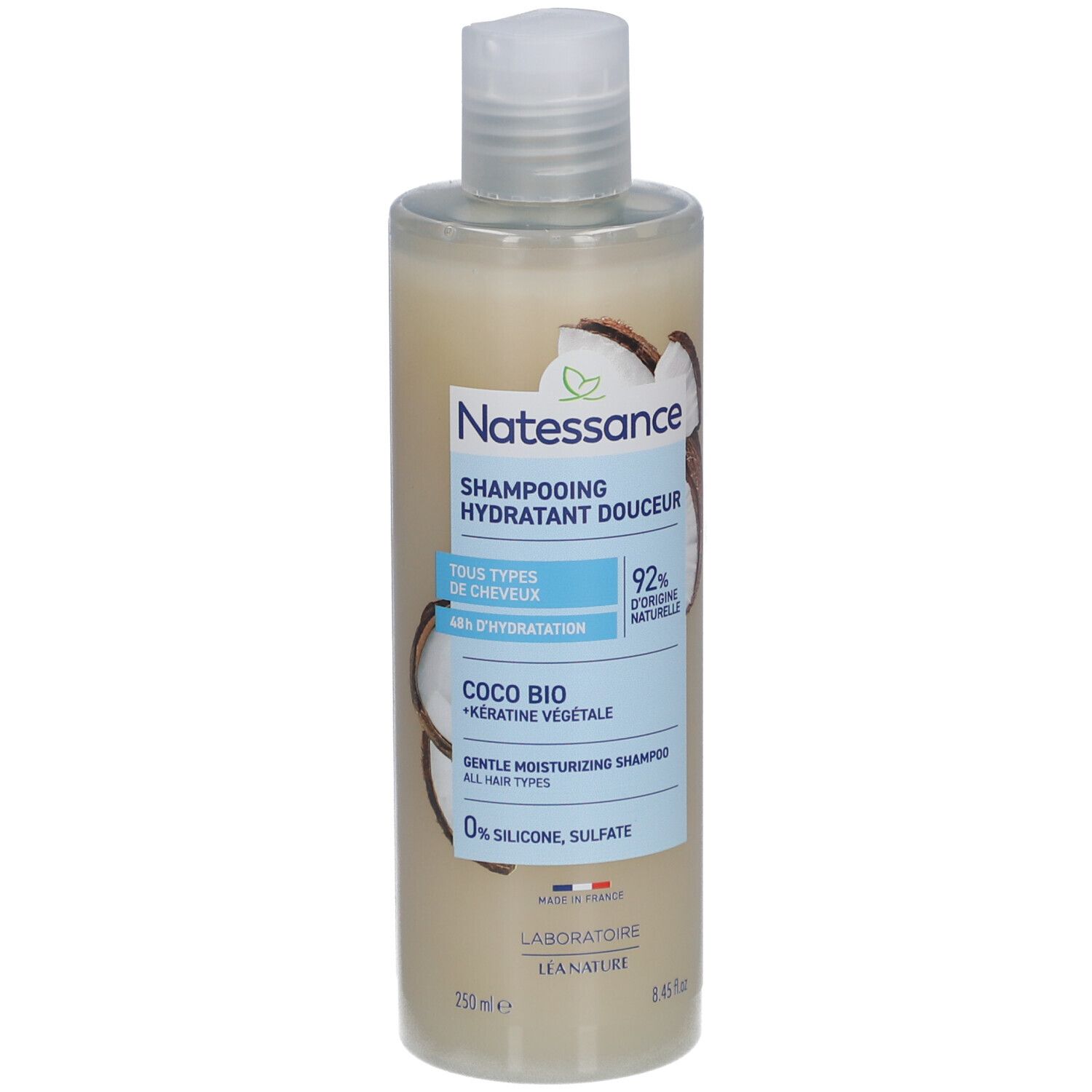 Flacon de shampooing. Inscription: NATESSANCE, Shampoing hydratant douceur, Coco Bio. 92% d'ingrédients naturels. Tous types de cheveux.