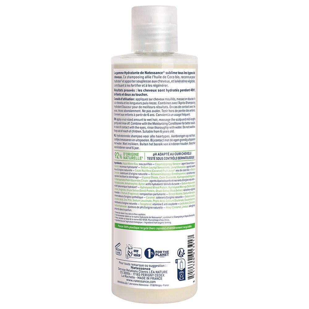 Dos du flacon de shampooing. Texte: instructions d'utilisation, ingrédients, pH, testé dermatologiquement. Logos: 1% for the planet, Le Nature.