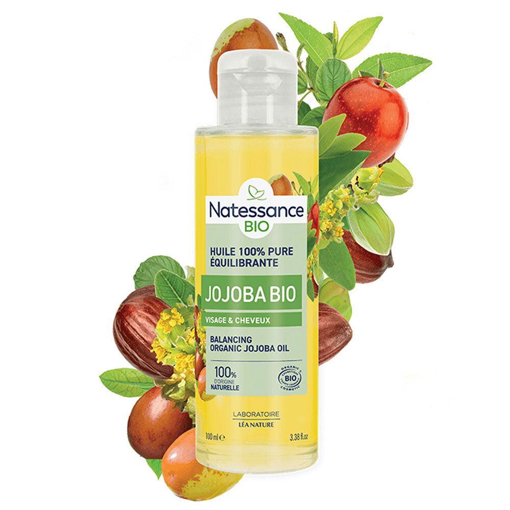 Flacon d'huile de jojoba BIO SO BIO ETIC Natessance. Étiquette verte. Illustration de fruits et feuilles de jojoba. Contenu clair.