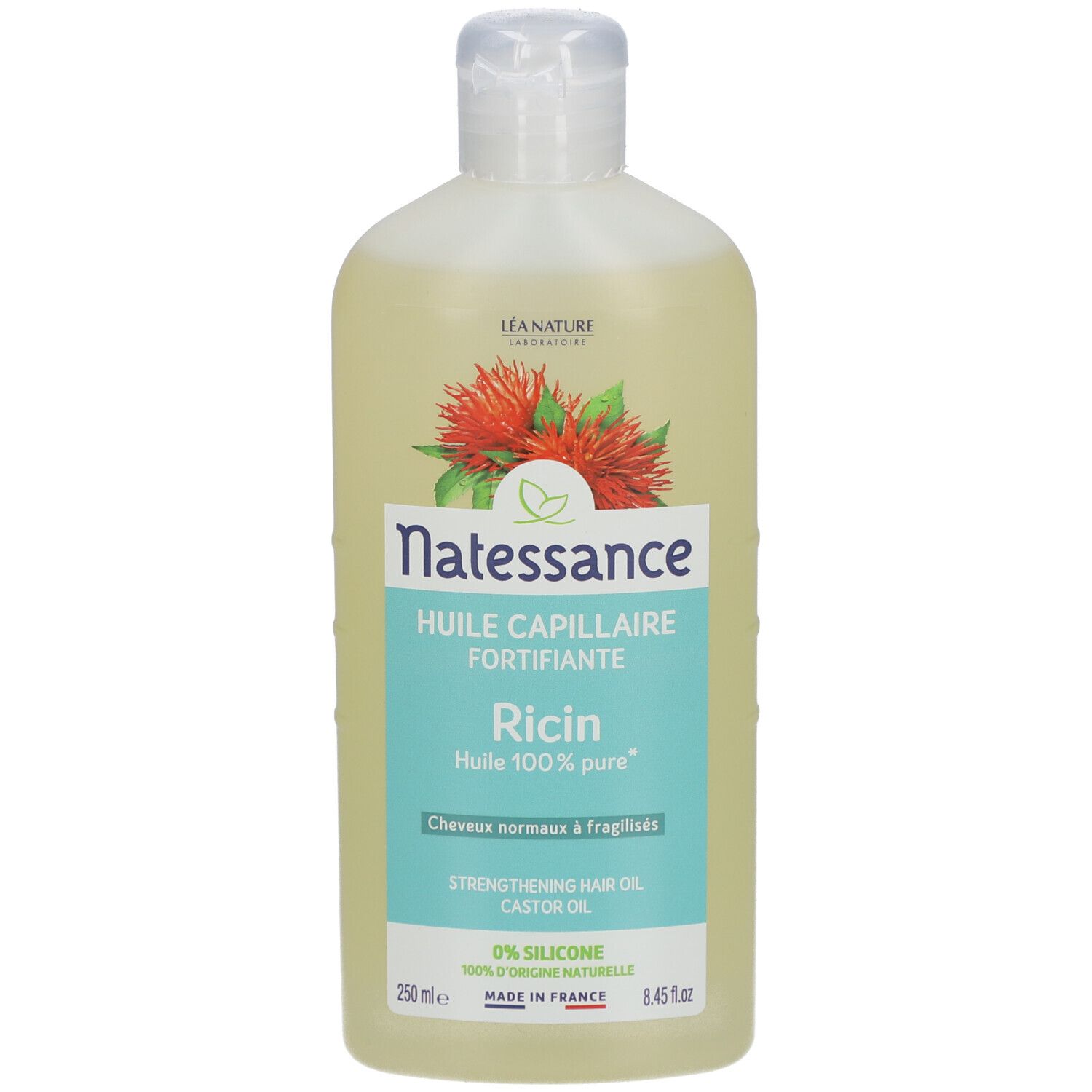 Fles Natessance Huile Capillaire Fortifiante Ricin. 100% pure ricinusolie. Witte dop en etiket met botanische illustratie.